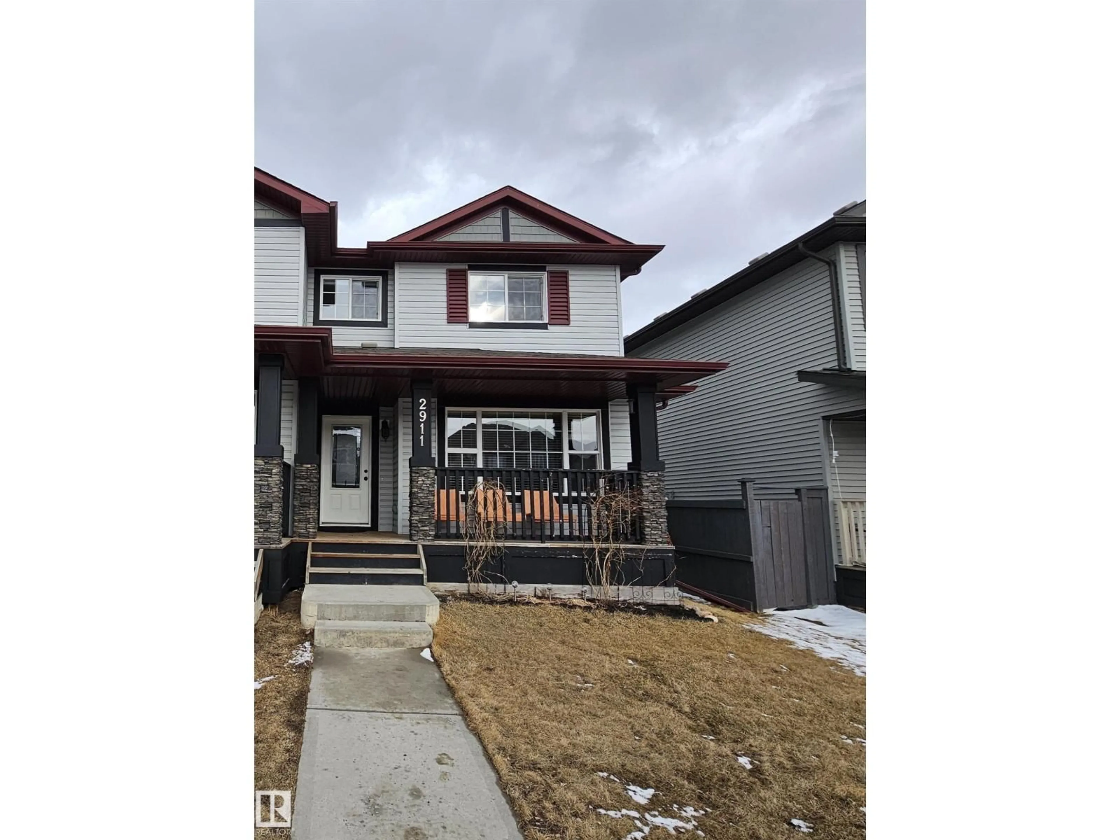 Home with vinyl exterior material, street for 2911 15 ST, Edmonton Alberta T6T0V6