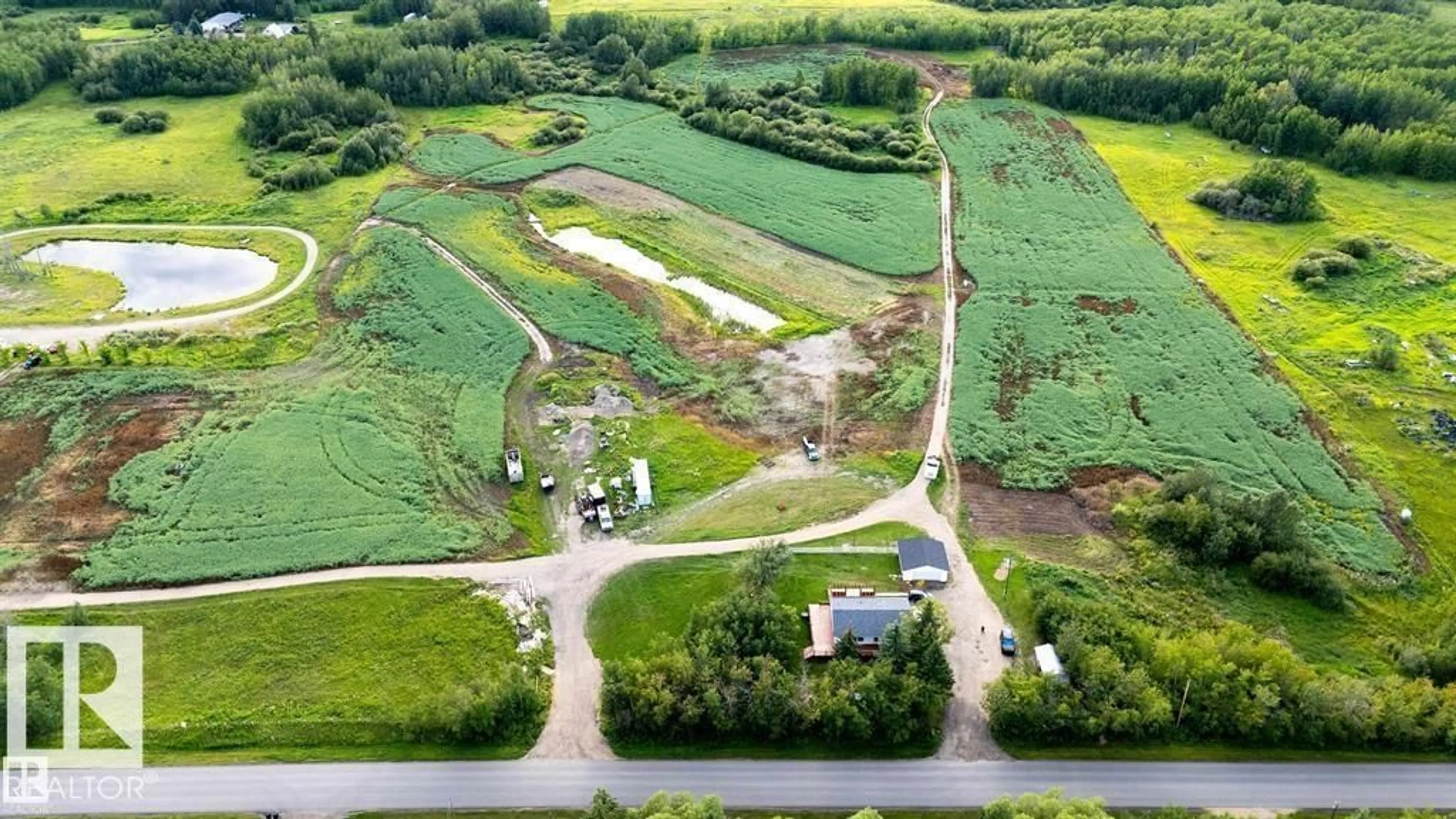 A pic from outside/outdoor area/front of a property/back of a property/a pic from drone, water/lake/river/ocean view for 52028 RGE ROAD 231, Rural Strathcona County Alberta T8B1A3