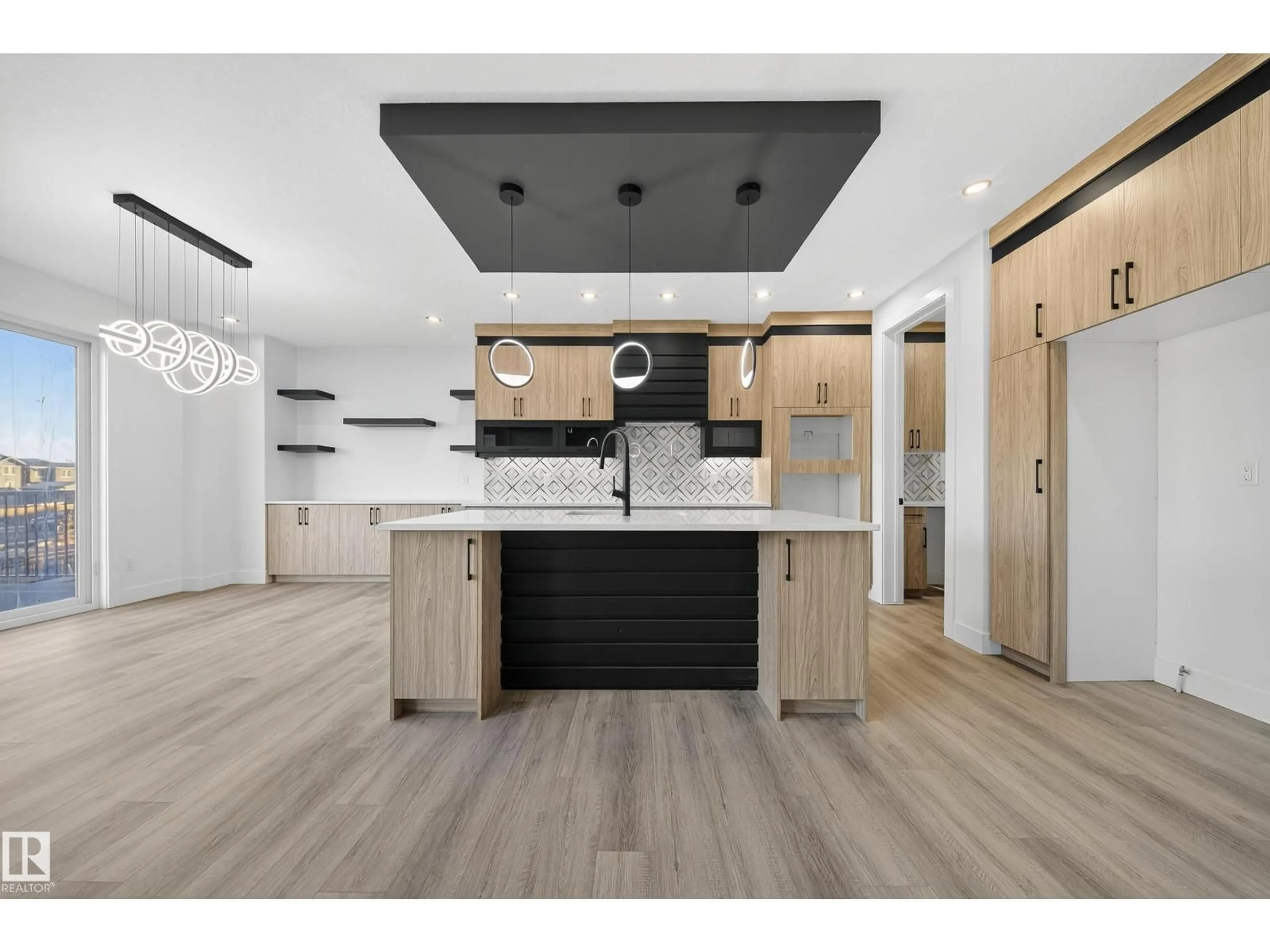 Open concept kitchen, wood/laminate floor for 2010 COLLIP CR, Edmonton Alberta T6W5T4