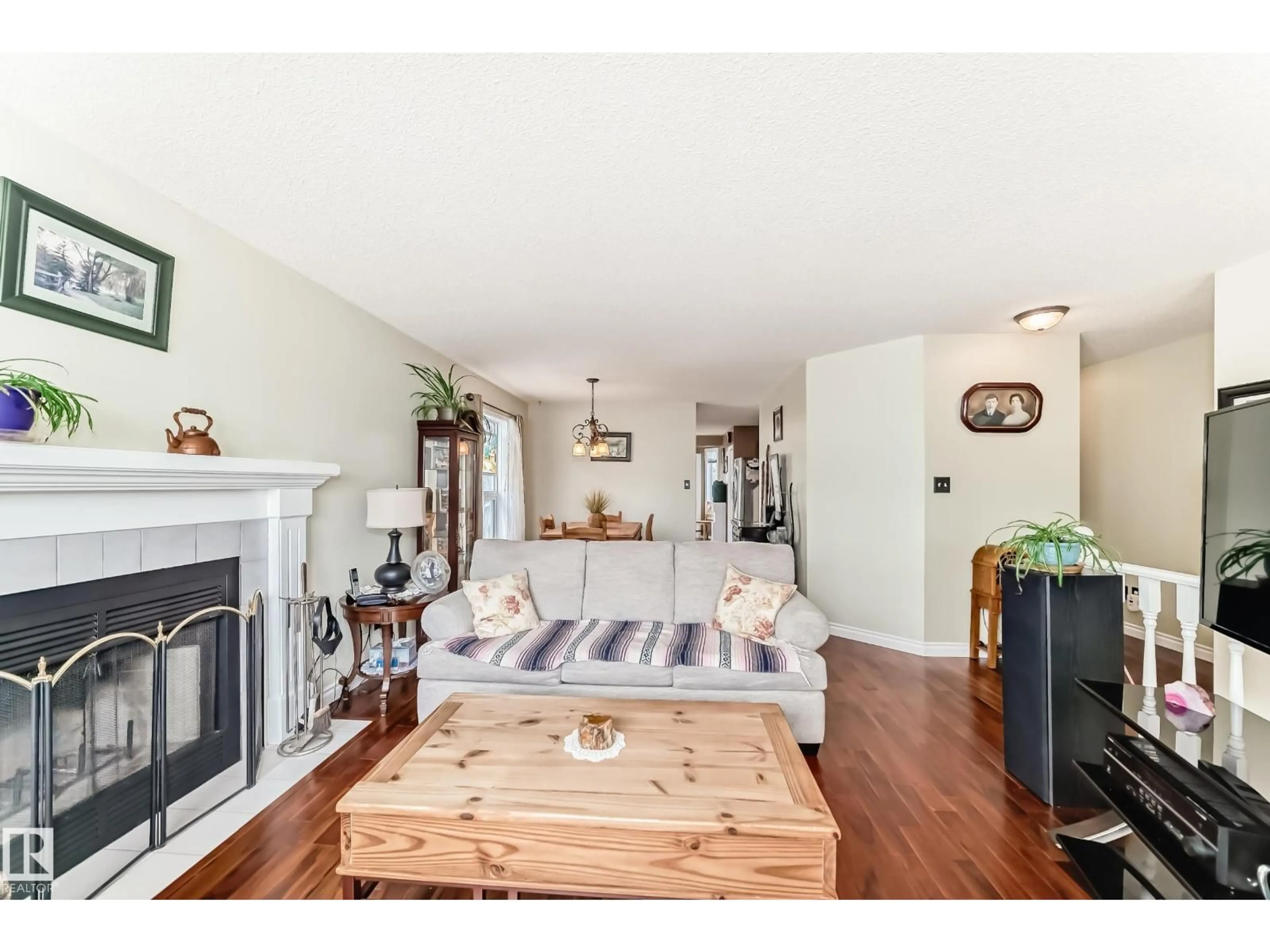 Living room with furniture, wood/laminate floor for 521 RAINBOW CR, Sherwood Park Alberta T8A5M8