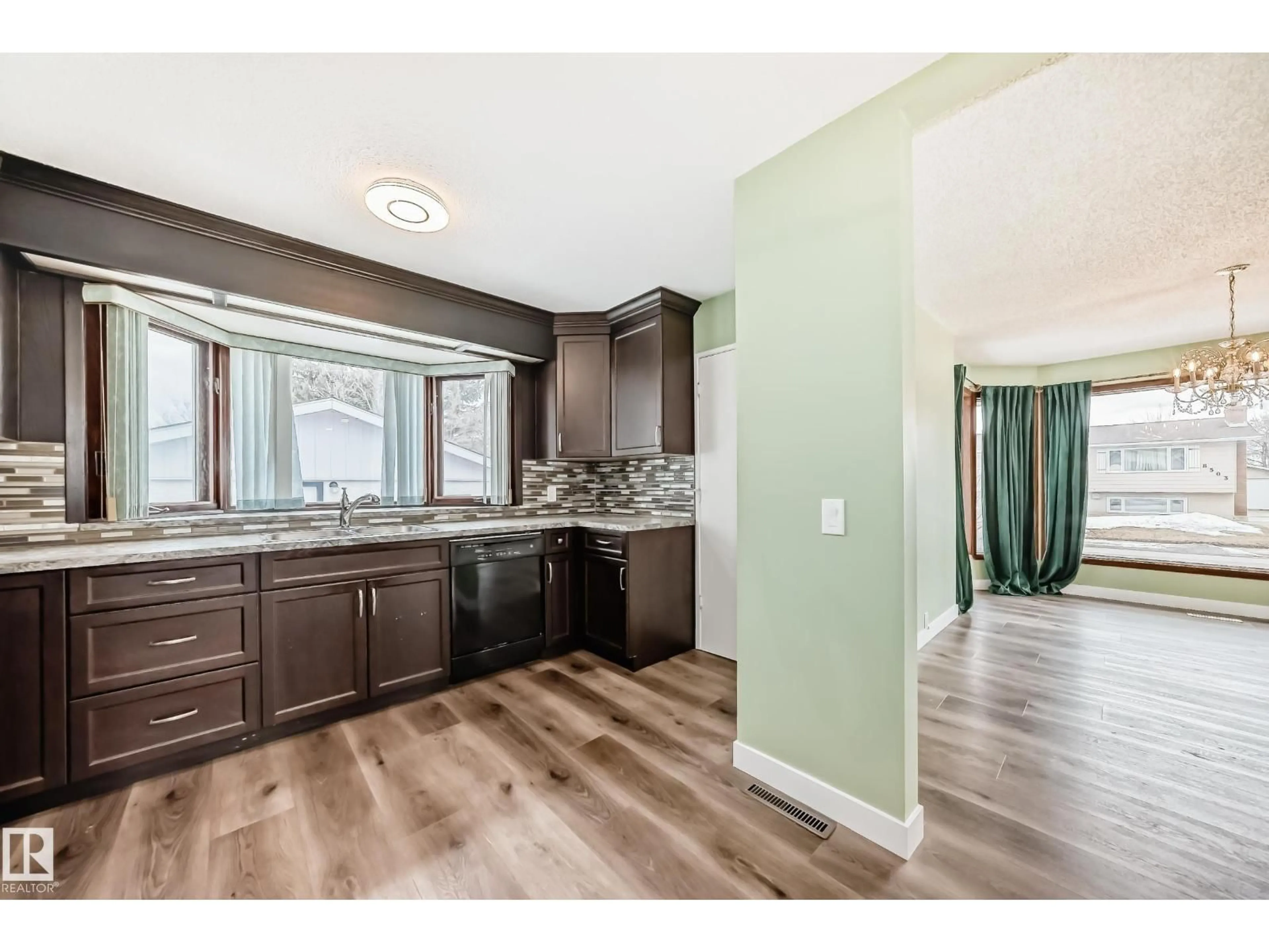 Open concept kitchen, wood/laminate floor for 17104 85 AV, Edmonton Alberta T5T0K8