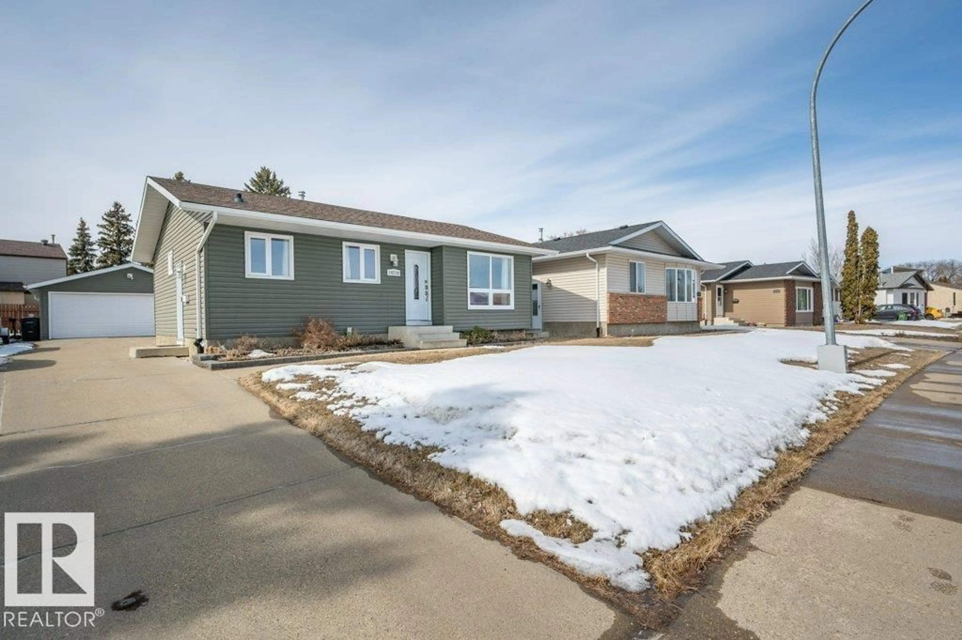 Home with vinyl exterior material, street for 14210 22A ST NW, Edmonton Alberta T5Y1E1