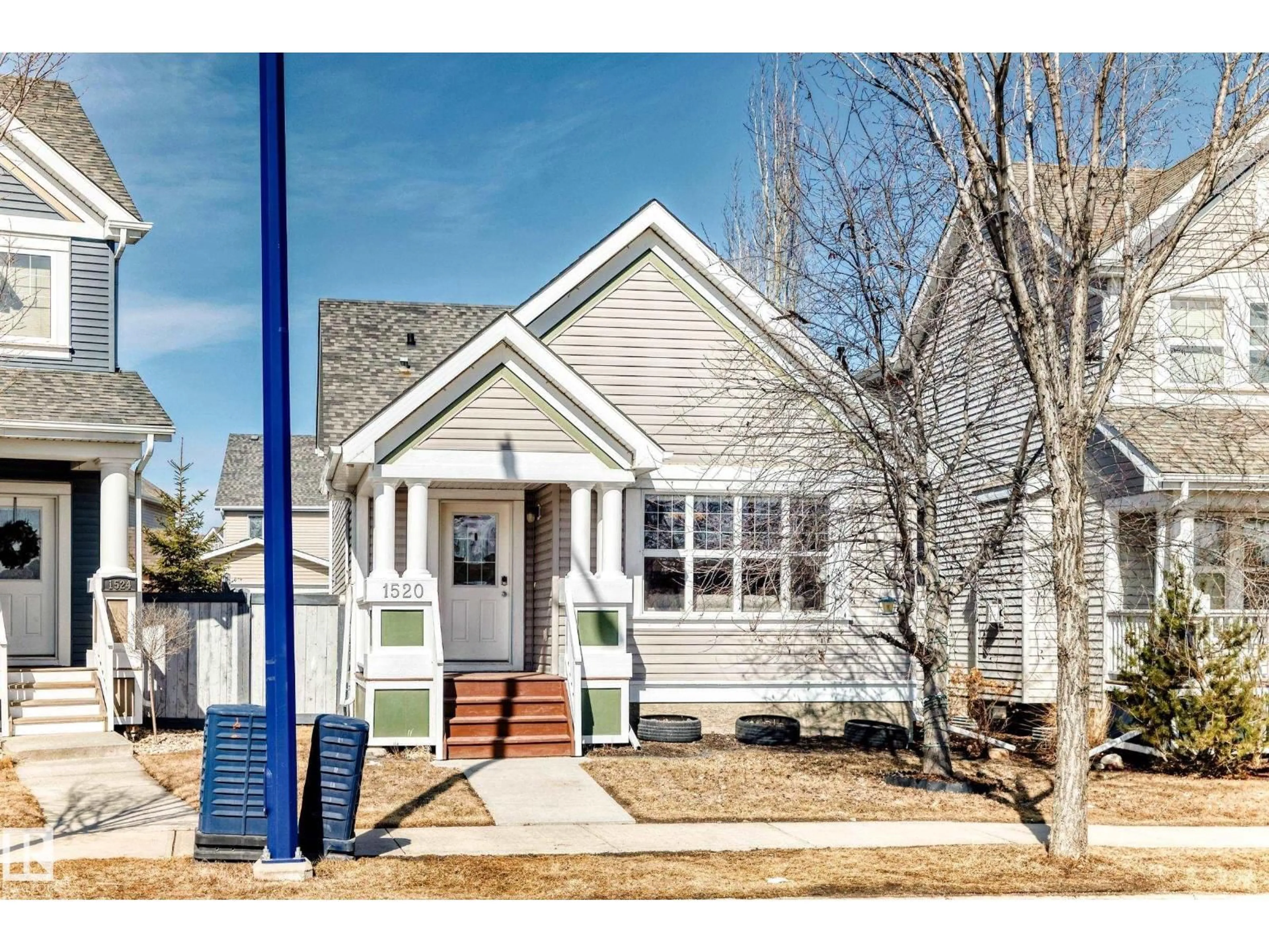 Home with vinyl exterior material, street for 1520 70 ST, Edmonton Alberta T6X0H3