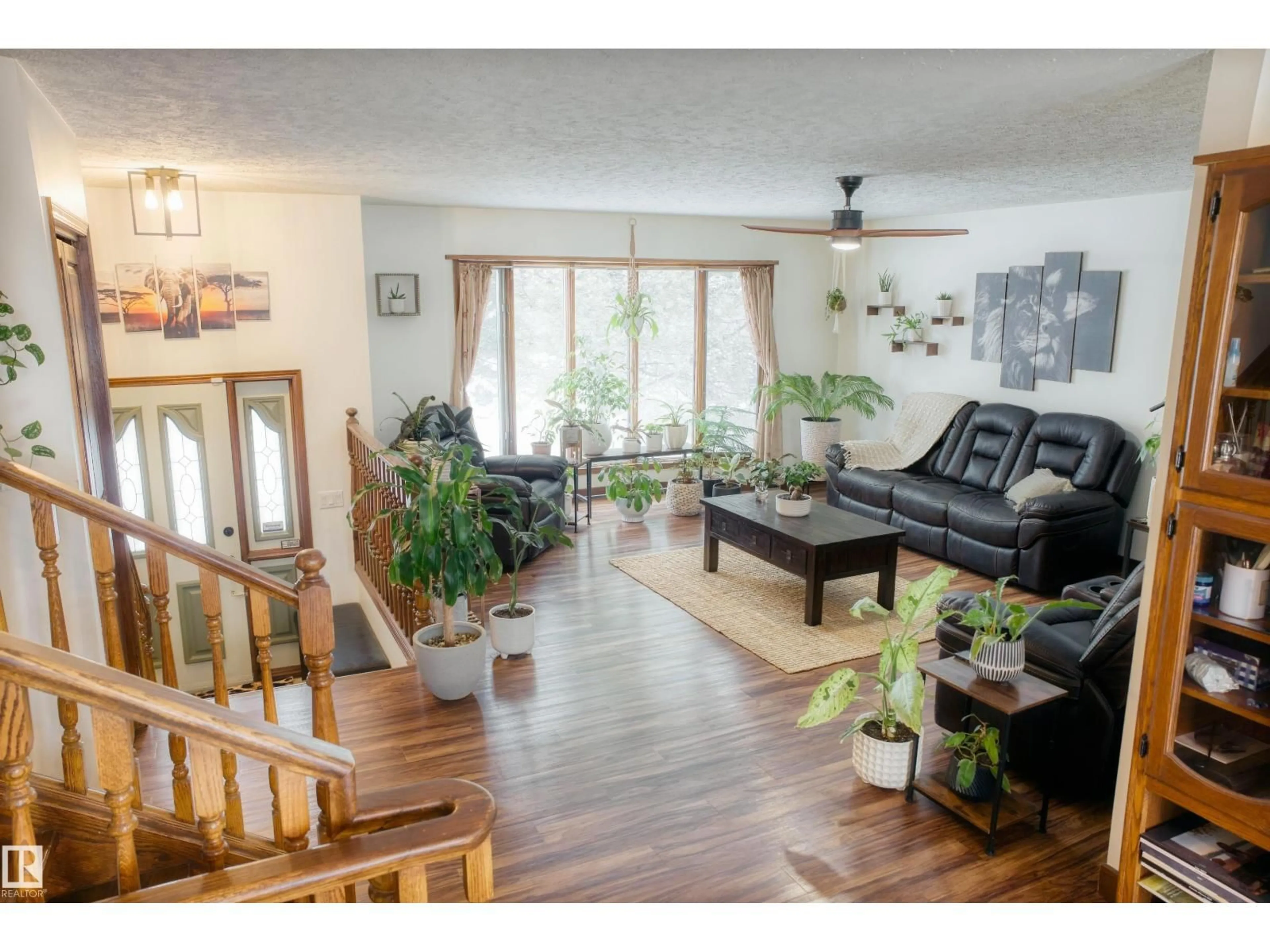 Living room with furniture, wood/laminate floor for 4311 49 AV, Barrhead Alberta T7N1J4