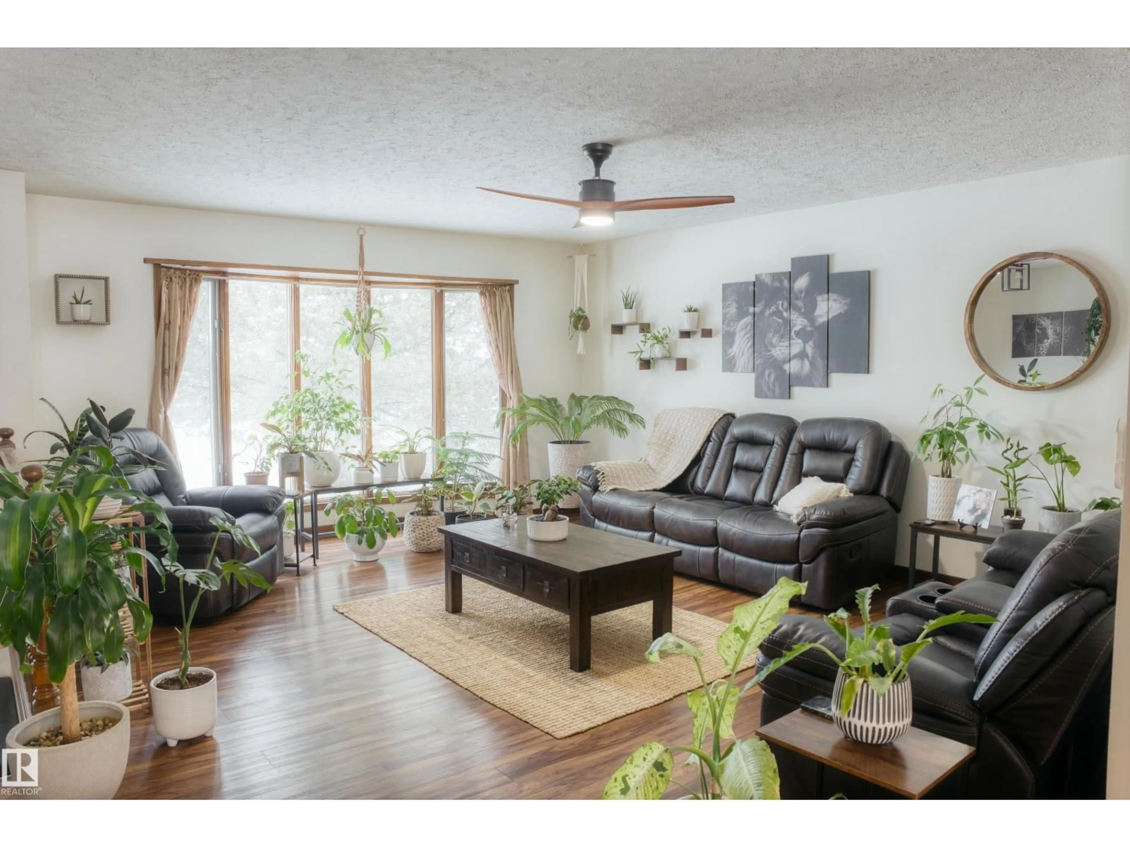 Living room with furniture, wood/laminate floor for 4311 49 AV, Barrhead Alberta T7N1J4