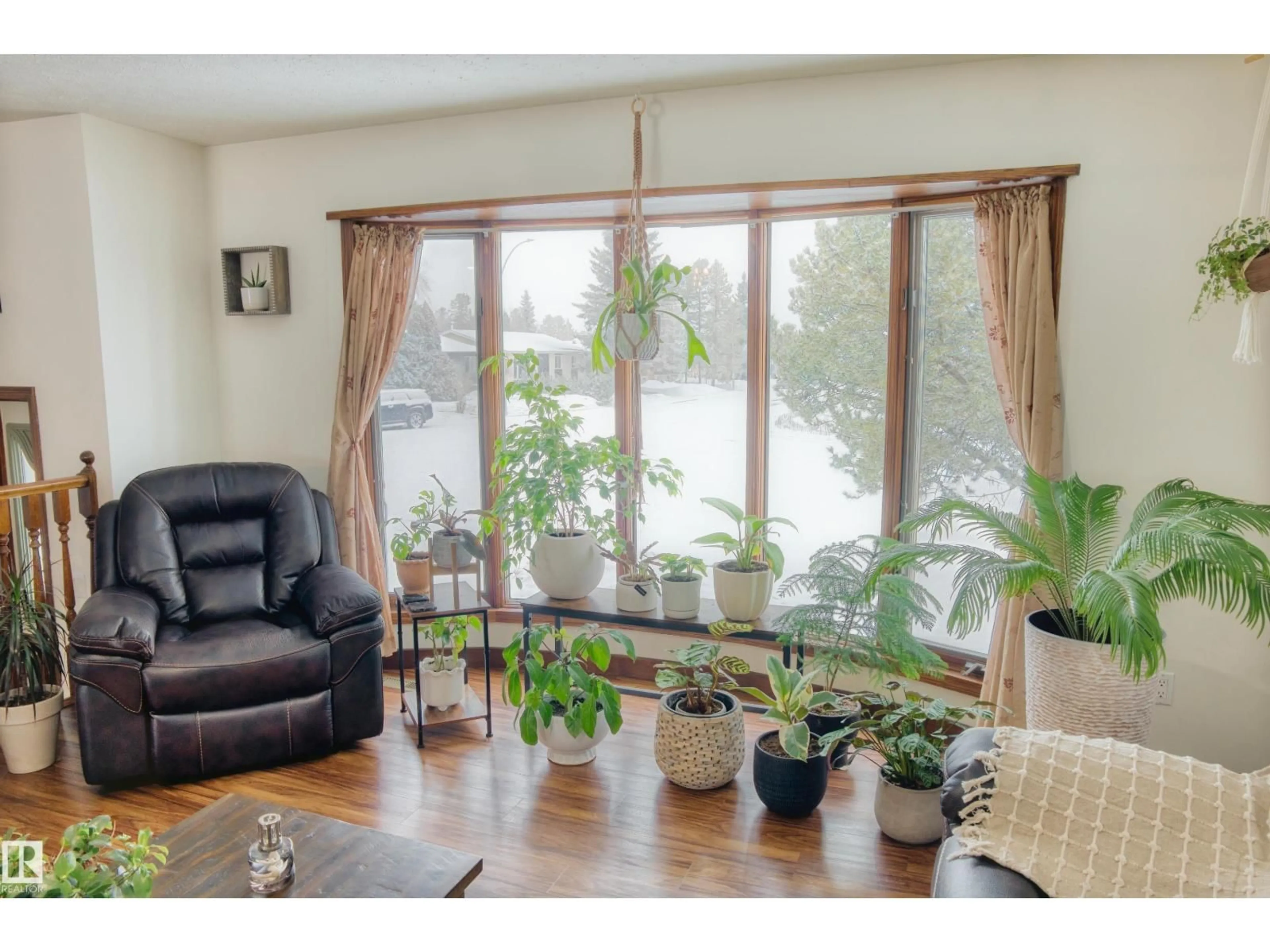 Living room with furniture, wood/laminate floor for 4311 49 AV, Barrhead Alberta T7N1J4