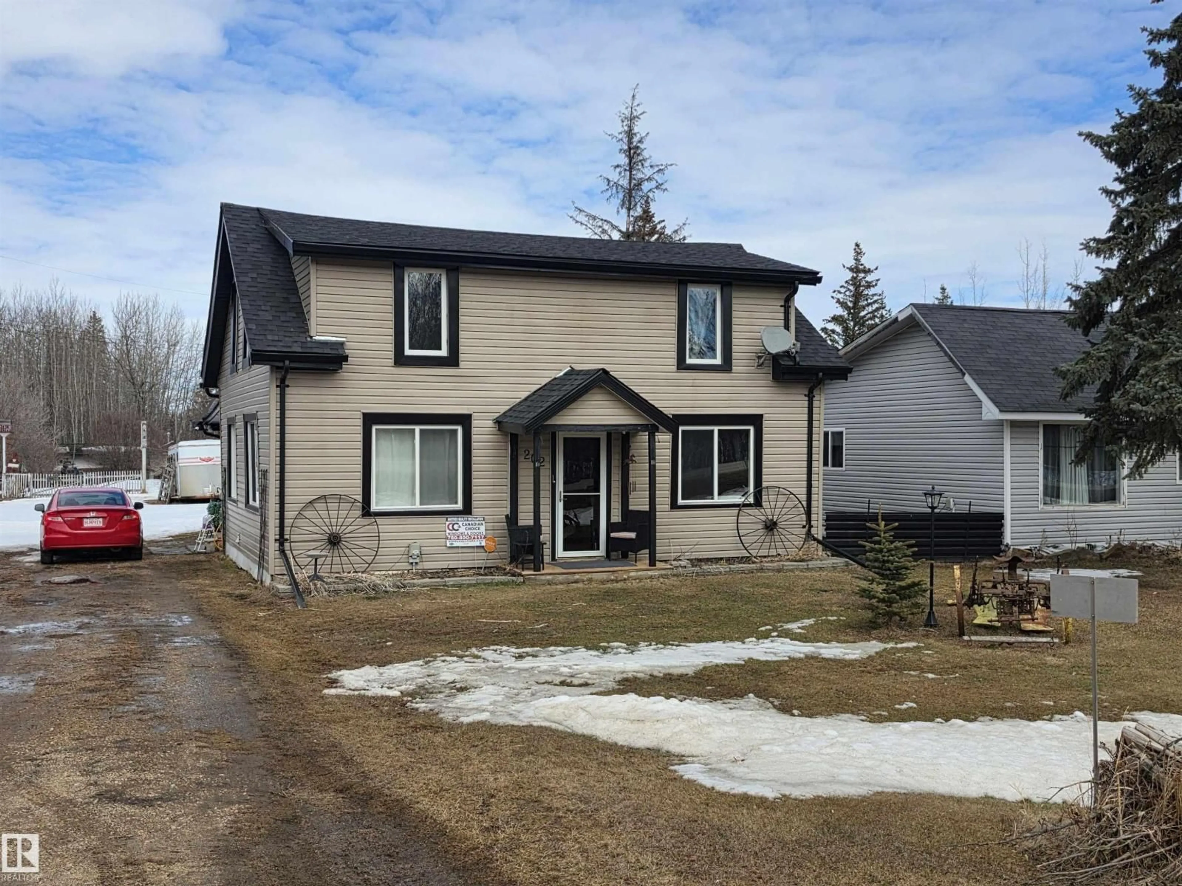 Home with vinyl exterior material, street for 202 - 56102 RGE ROAD 53, Cherhill Alberta T0E0J0