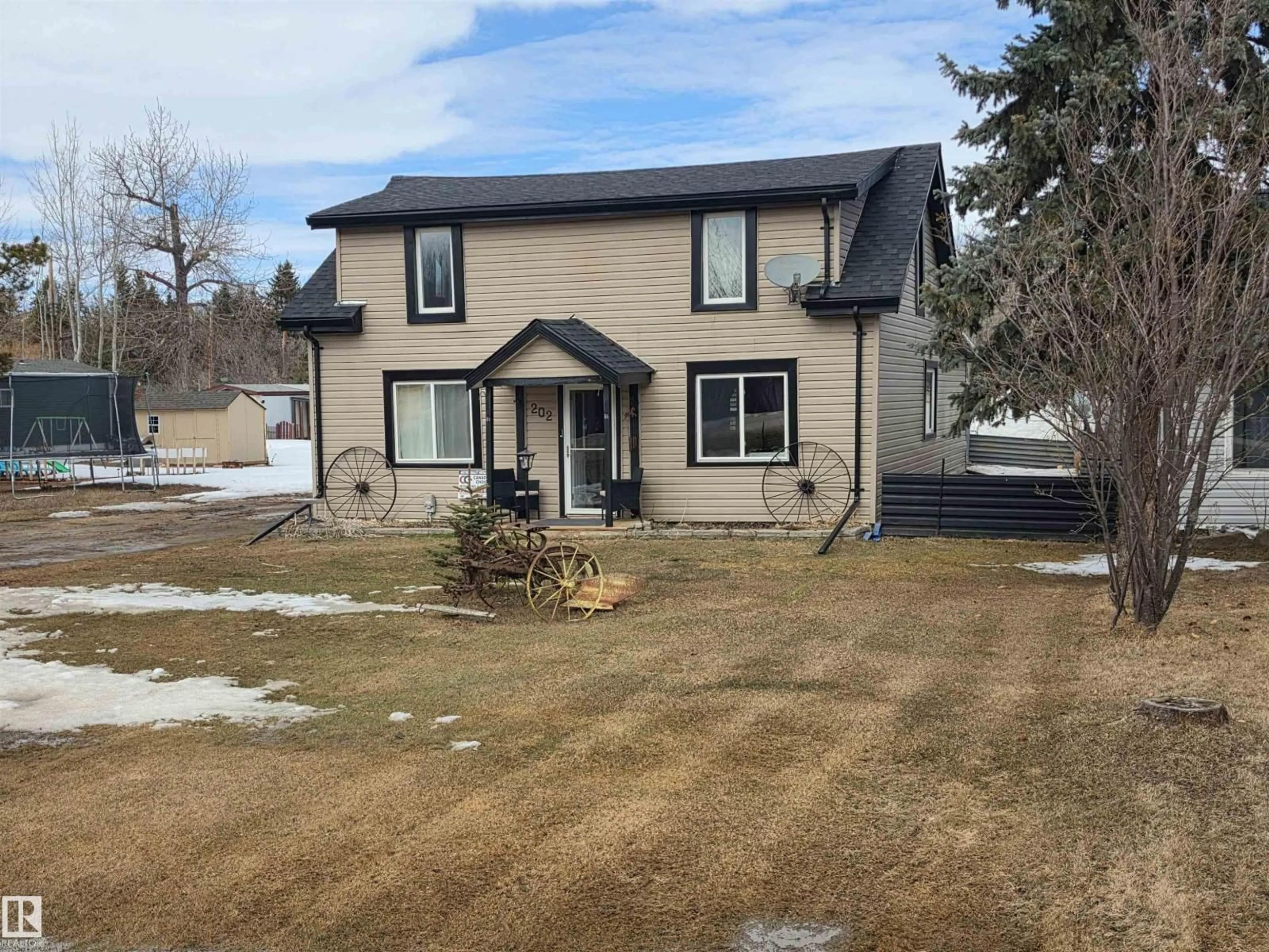 A pic from outside/outdoor area/front of a property/back of a property/a pic from drone, street for 202 - 56102 RGE ROAD 53, Cherhill Alberta T0E0J0