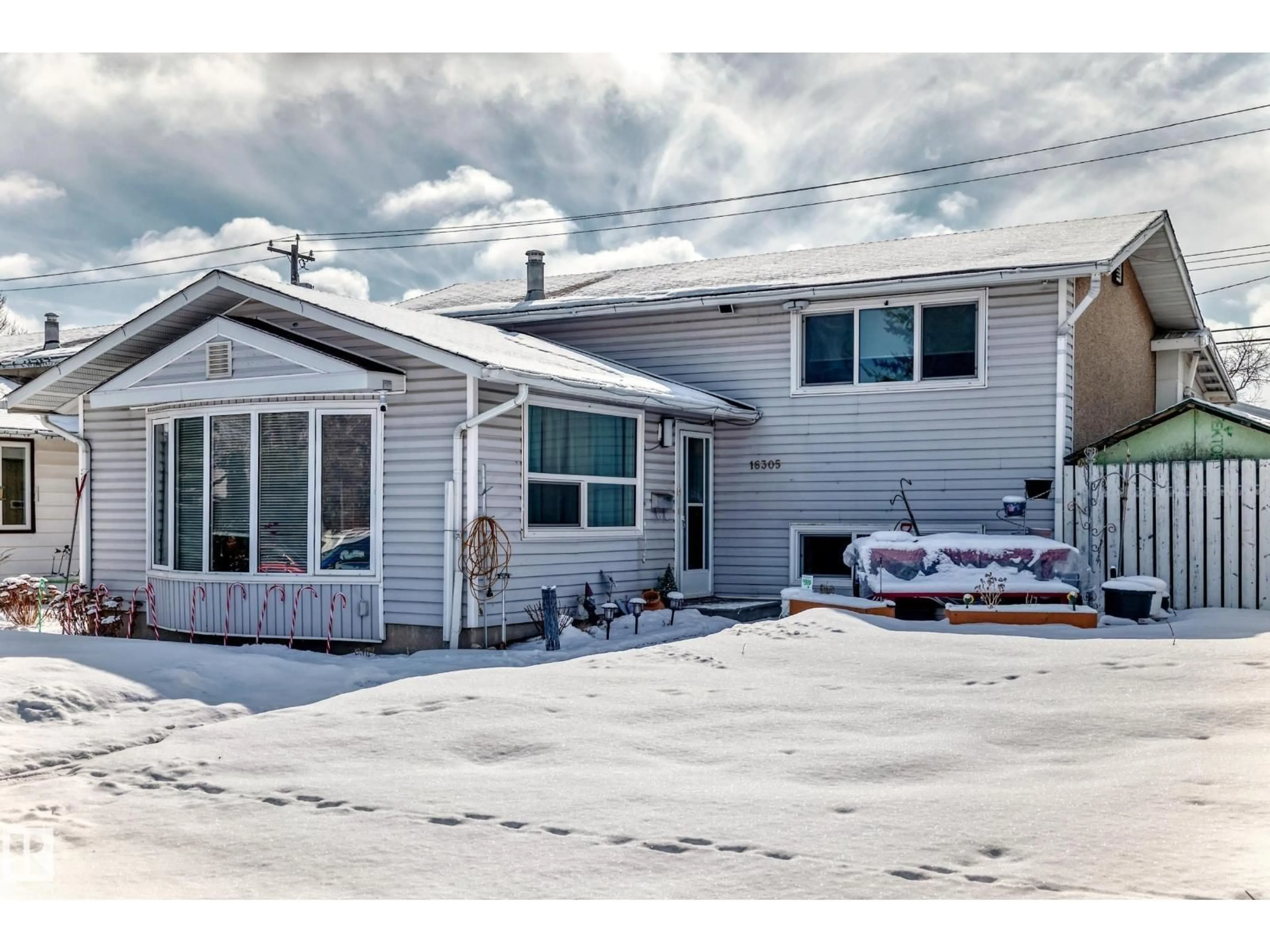 Home with vinyl exterior material, street for 16305 107A AVE, Edmonton Alberta T5P0Z4