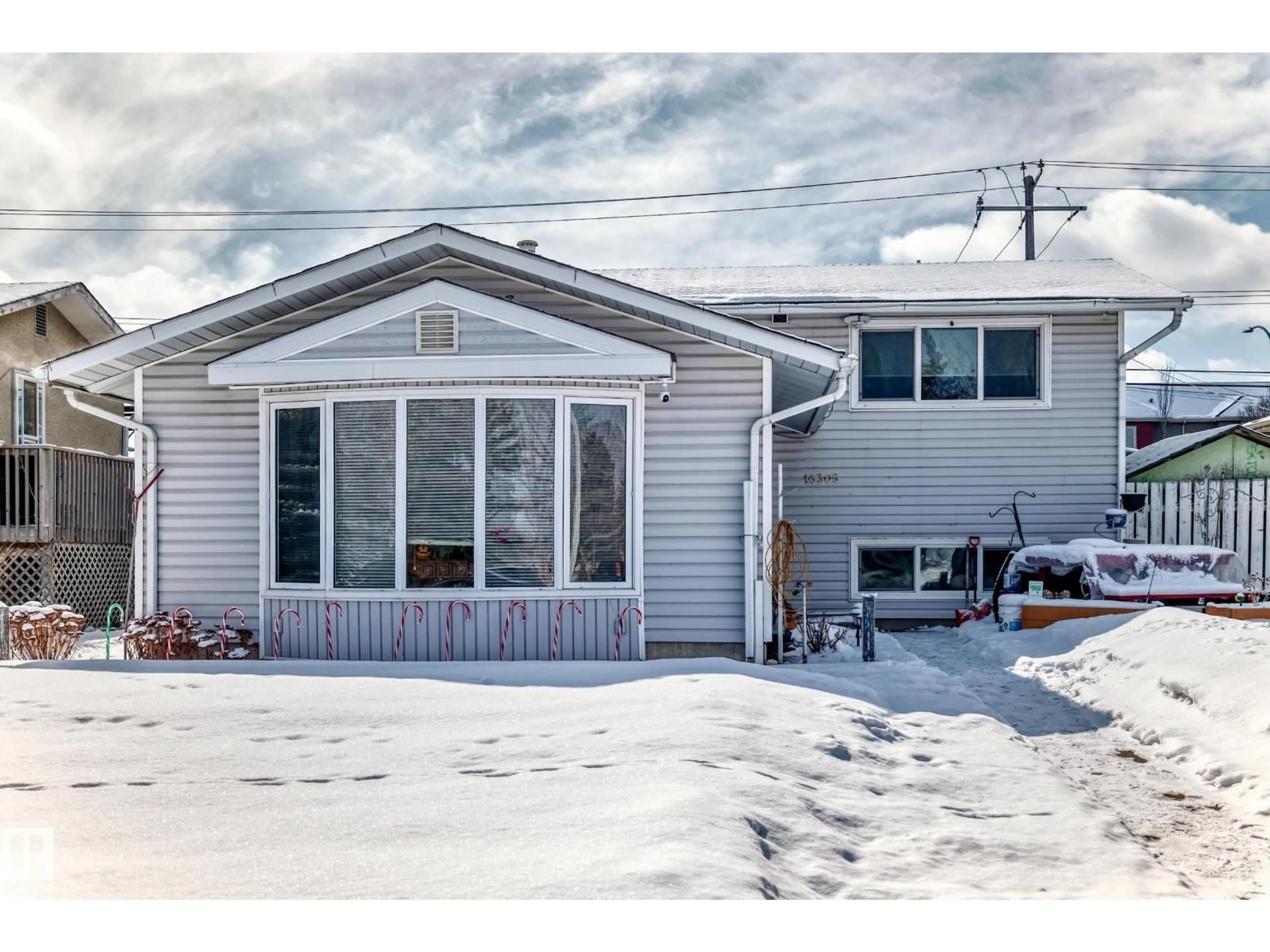 Home with vinyl exterior material, street for 16305 107A AVE, Edmonton Alberta T5P0Z4
