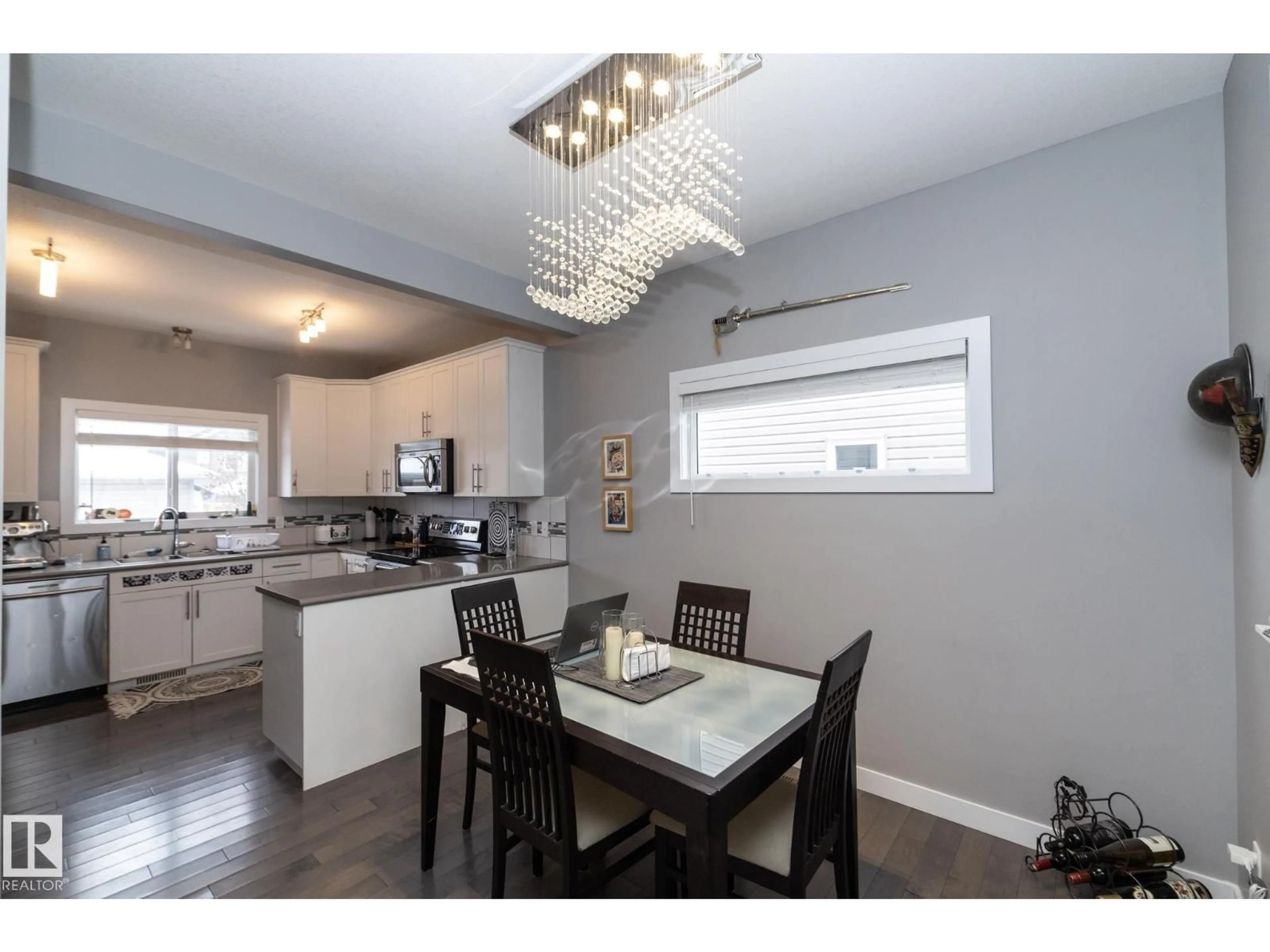 Open concept kitchen, wood/laminate floor for 7359 179 AV, Edmonton Alberta T5Z0M7