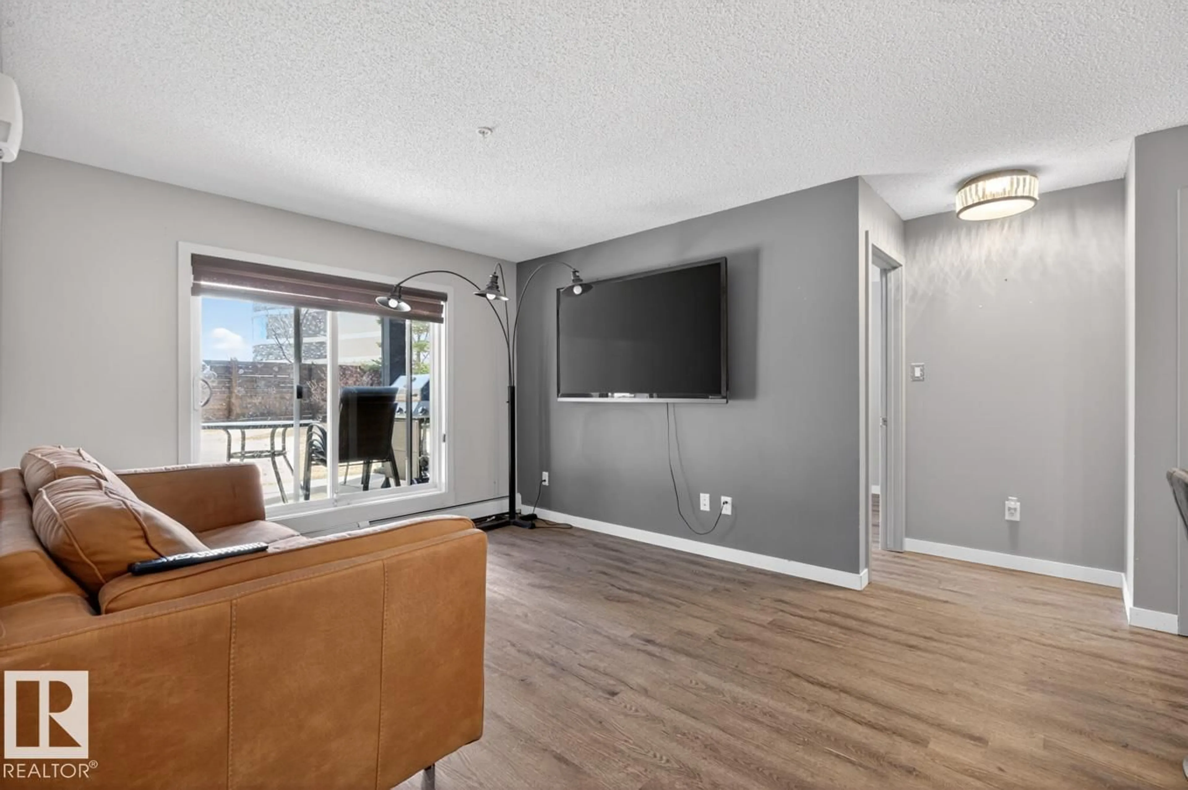 Living room with furniture, unknown for #109 - 340 WINDERMERE RD, Edmonton Alberta T6W2P2