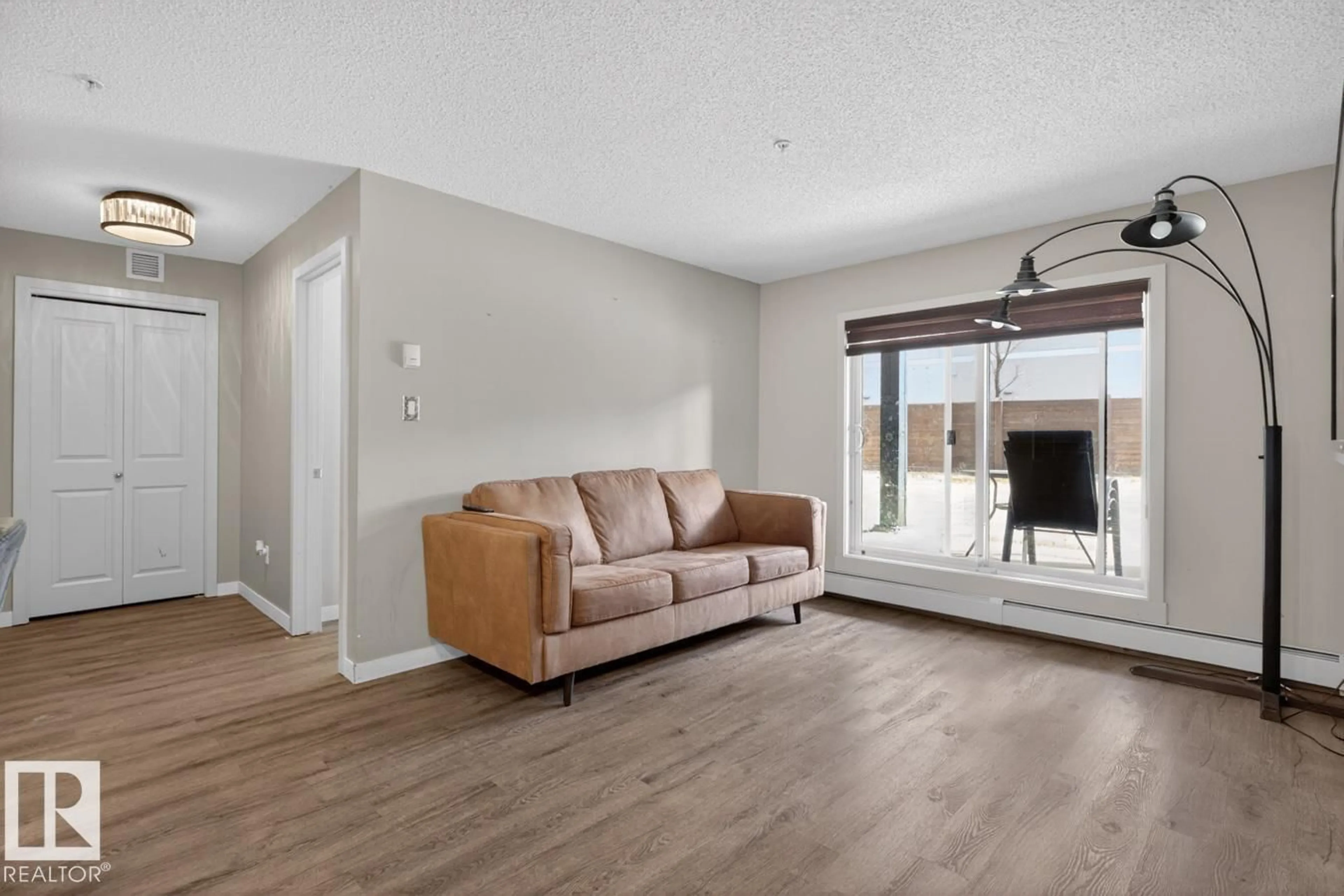 Living room with furniture, wood/laminate floor for #109 - 340 WINDERMERE RD, Edmonton Alberta T6W2P2