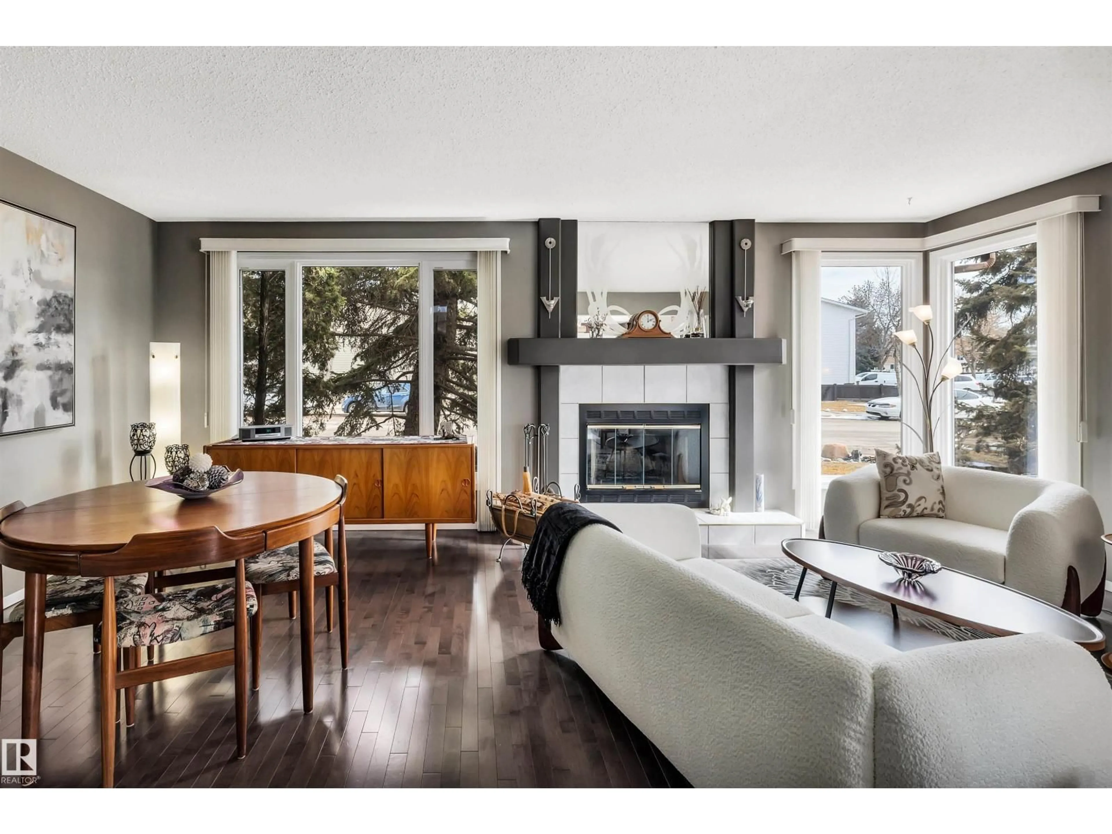 Living room with furniture, wood/laminate floor for NW - 7304 180 ST, Edmonton Alberta T5T2K8