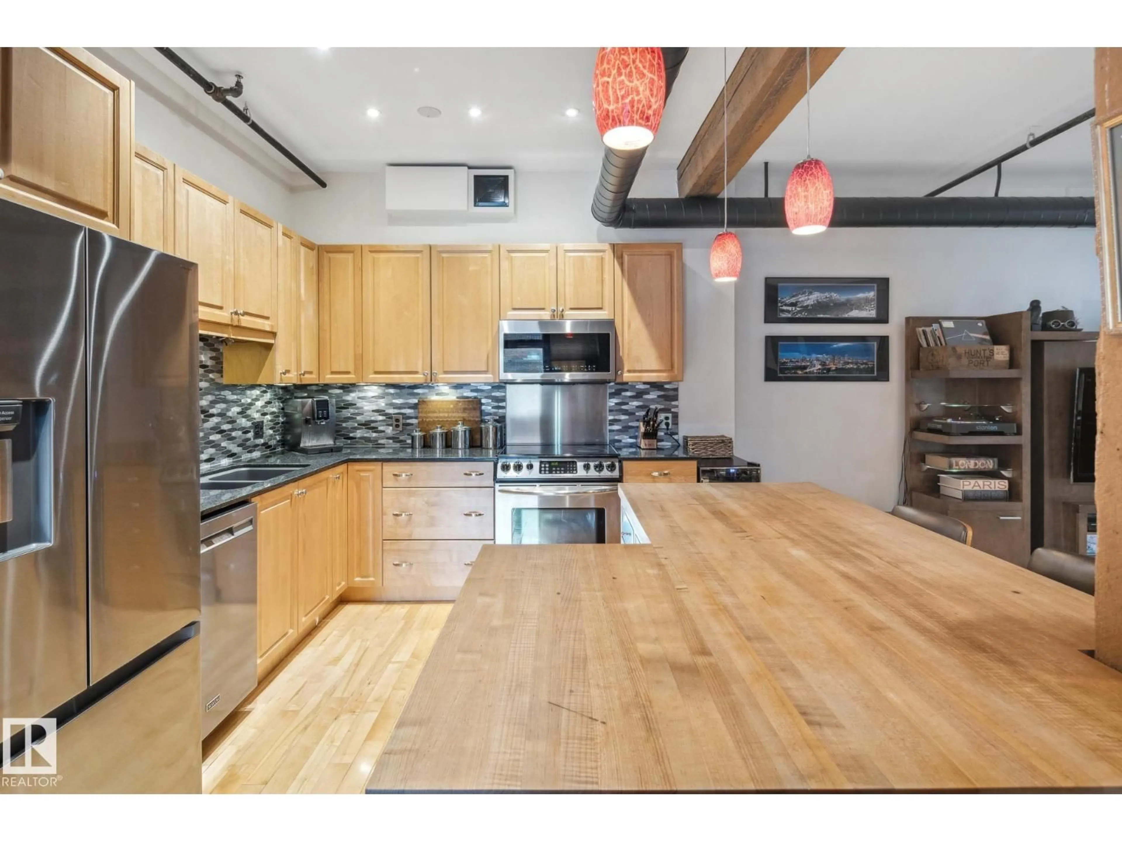 Open concept kitchen, wood/laminate floor for #302 - 10169 104 ST, Edmonton Alberta T5J1A5