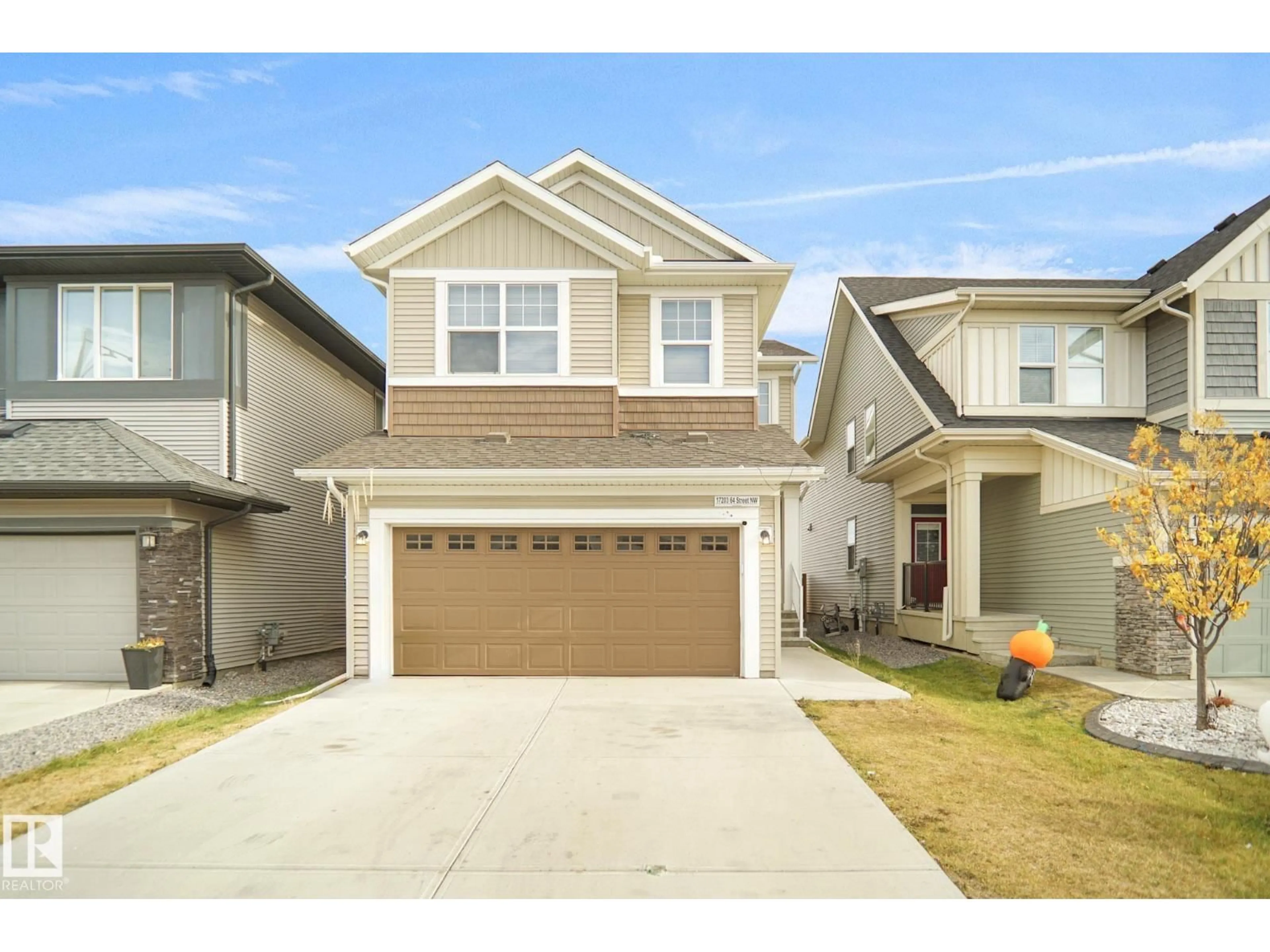 Home with vinyl exterior material, street for 17203 64 STREET NW, Edmonton Alberta T5Y3T6