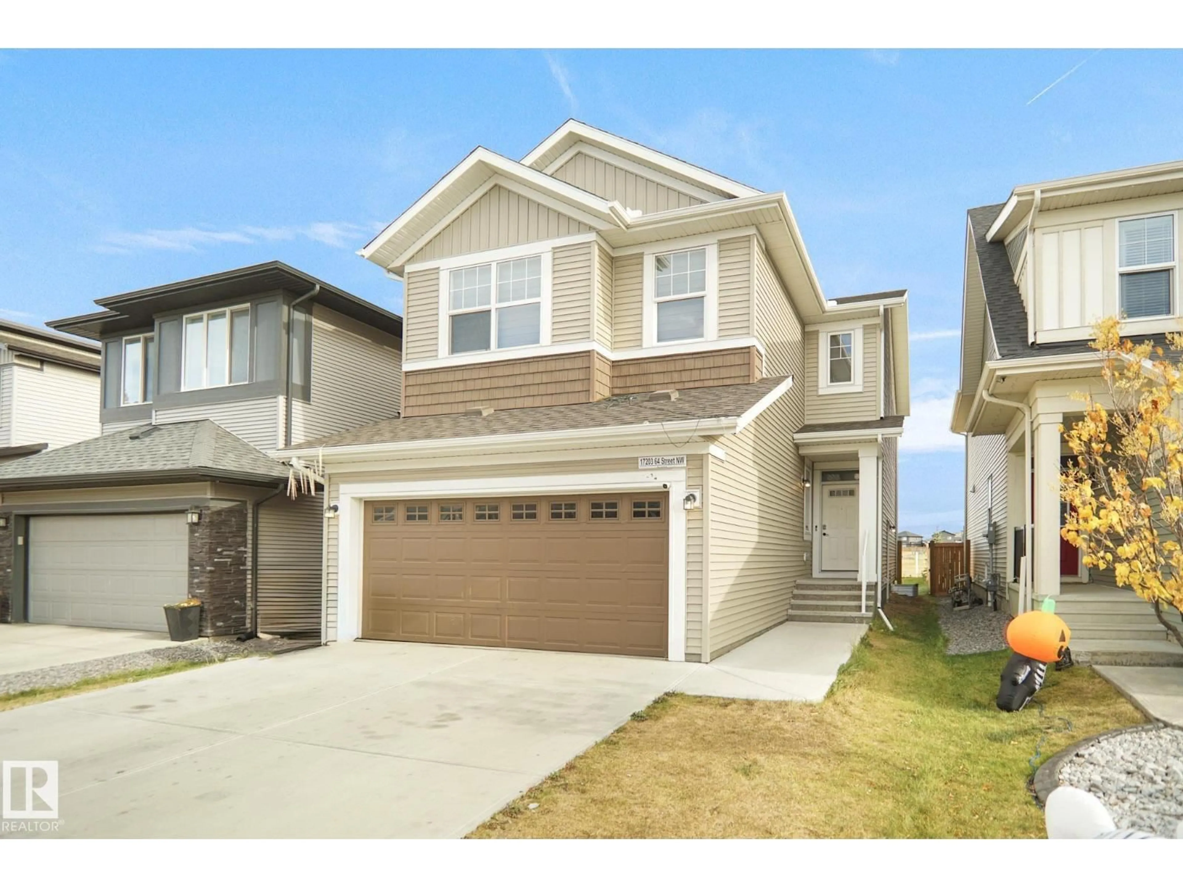 Home with vinyl exterior material, street for 17203 64 STREET NW, Edmonton Alberta T5Y3T6