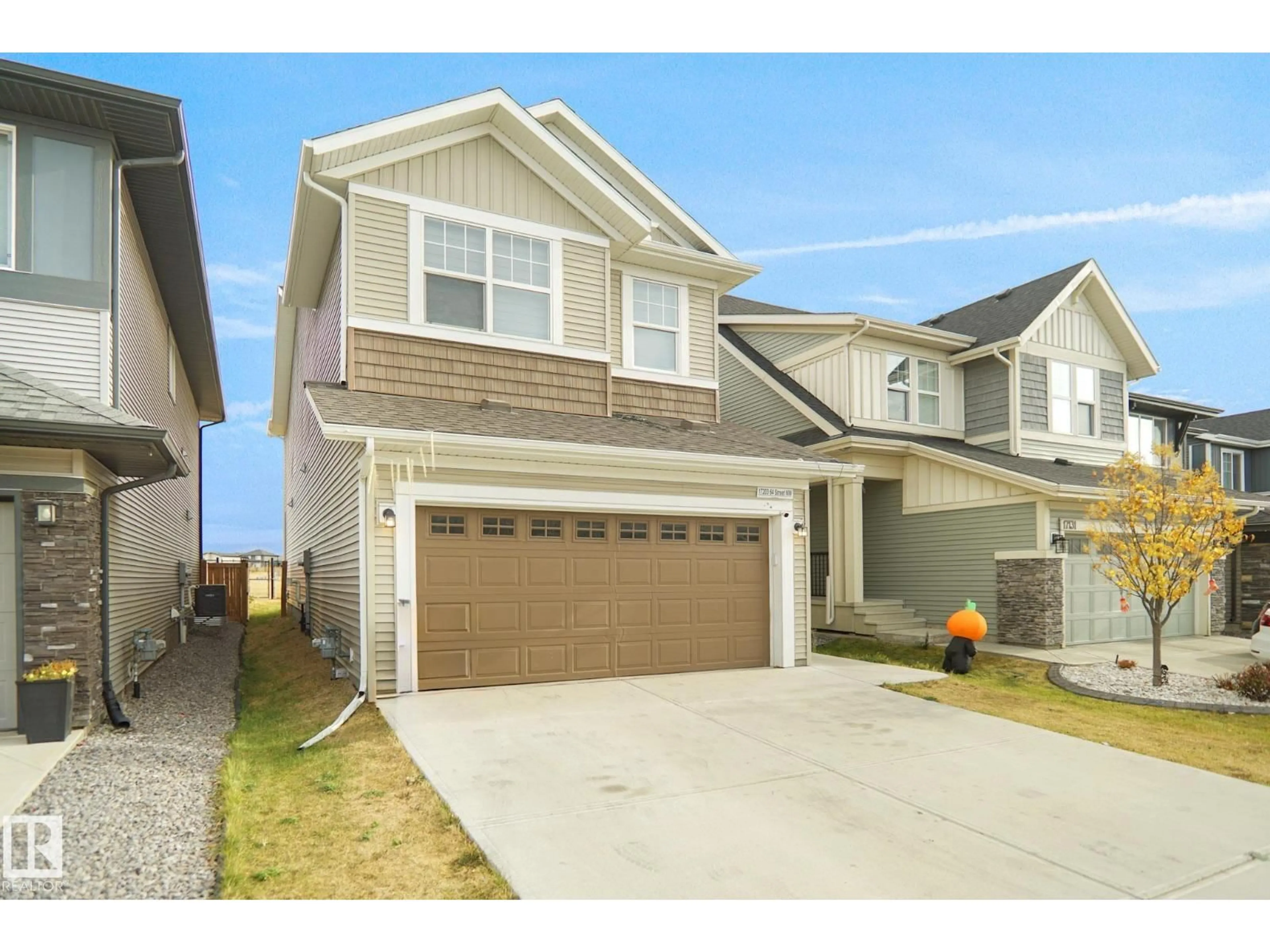 Home with vinyl exterior material, street for 17203 64 STREET NW, Edmonton Alberta T5Y3T6