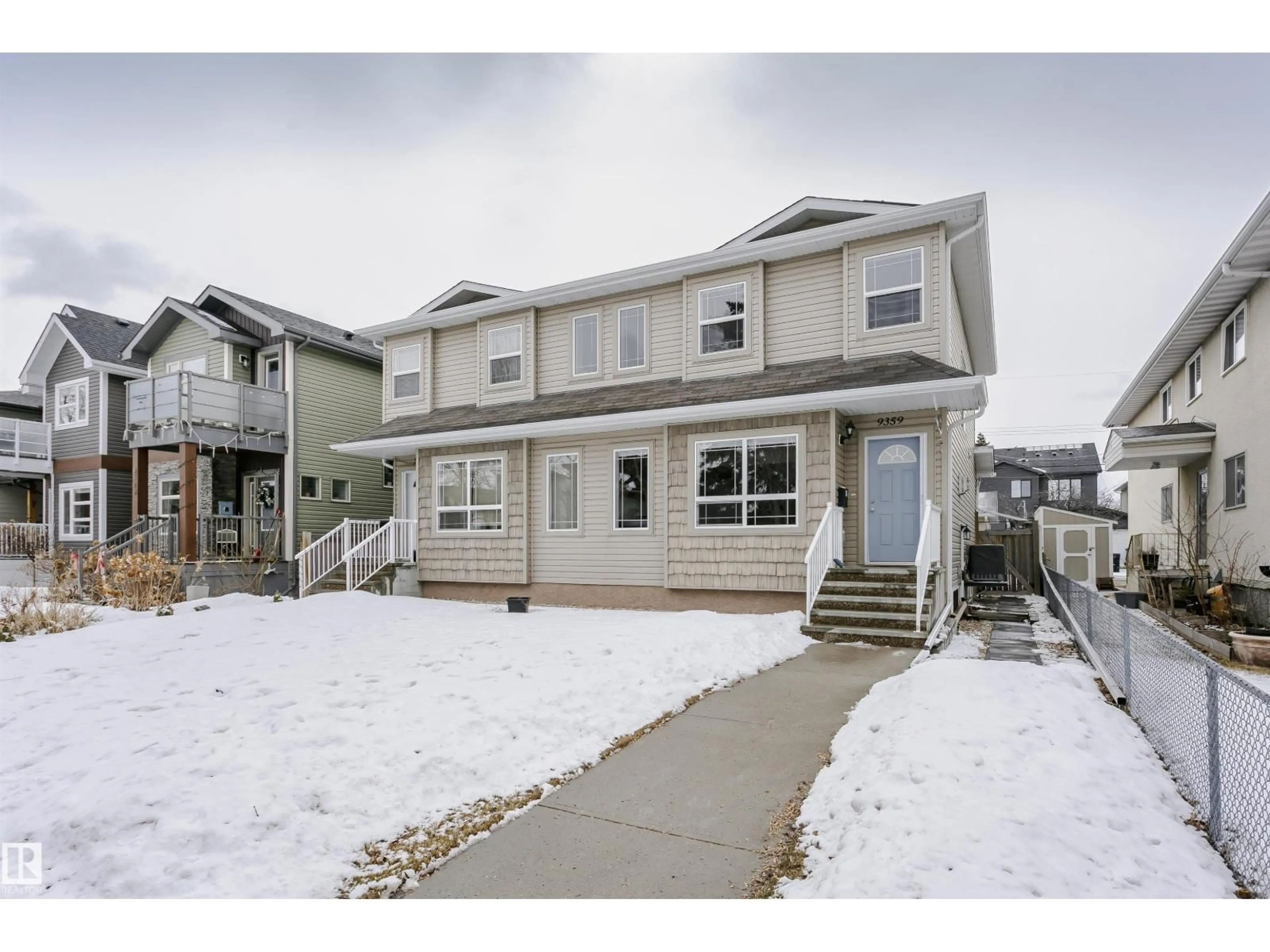 Home with vinyl exterior material, street for 9359 74 AV, Edmonton Alberta T6E1E3