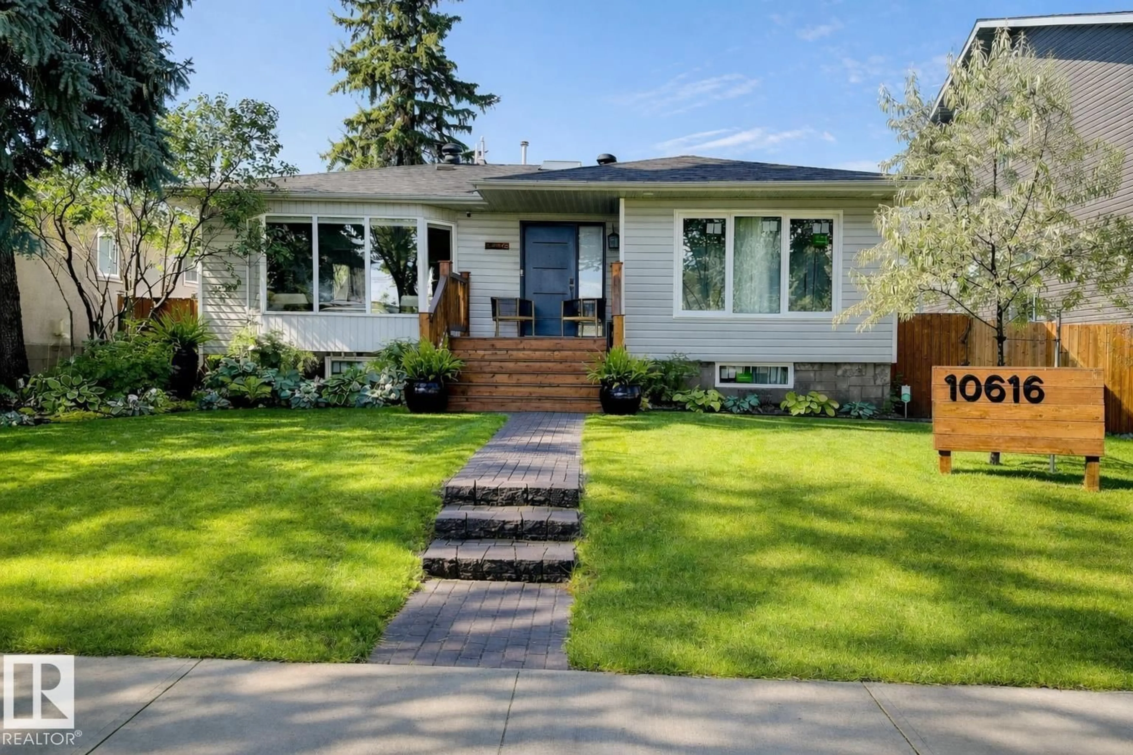 Home with vinyl exterior material, street for 10616 125 ST, Edmonton Alberta T5N1T6