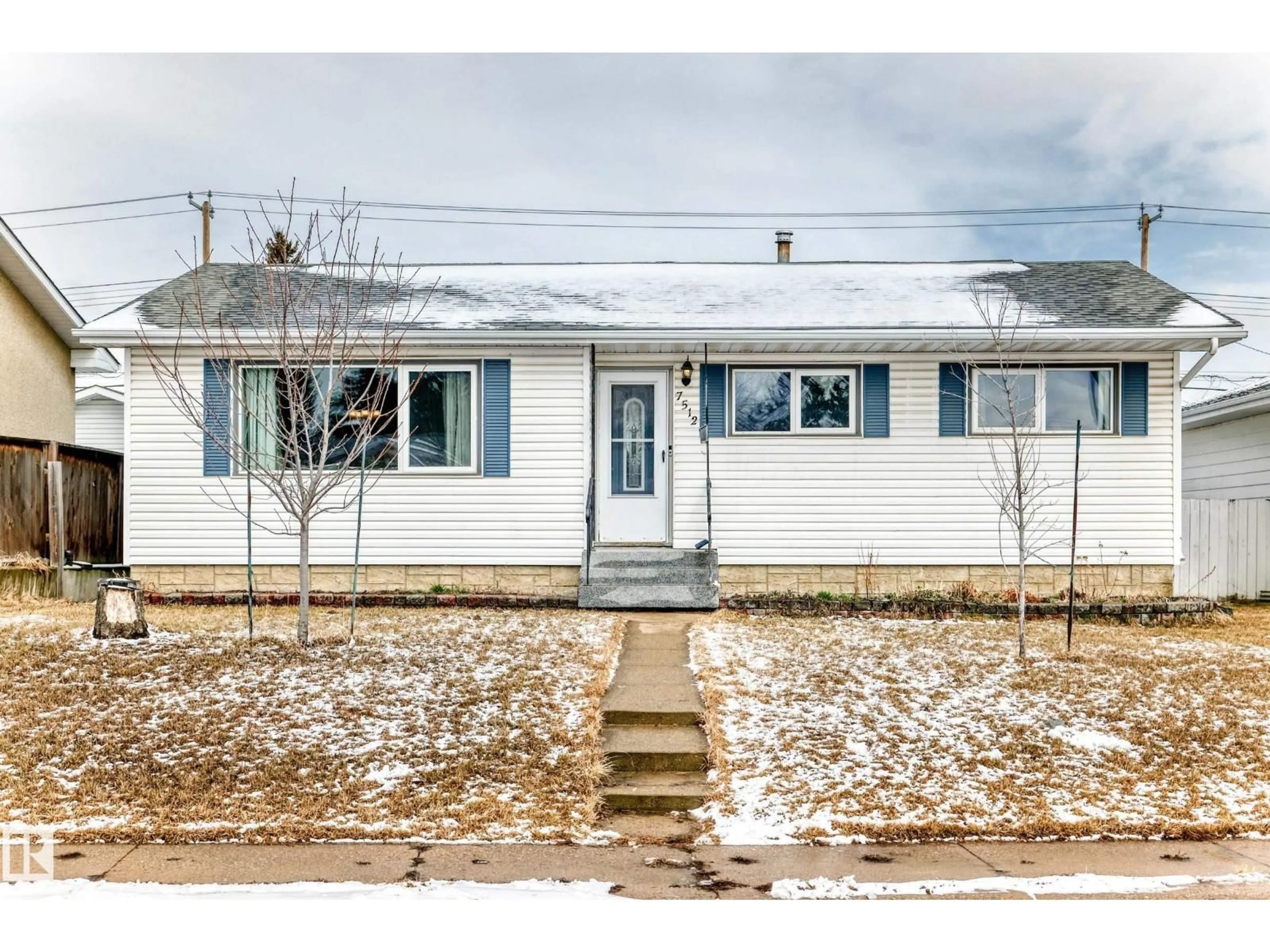 Home with vinyl exterior material, street for 7512 136 AV, Edmonton Alberta T5C2K5