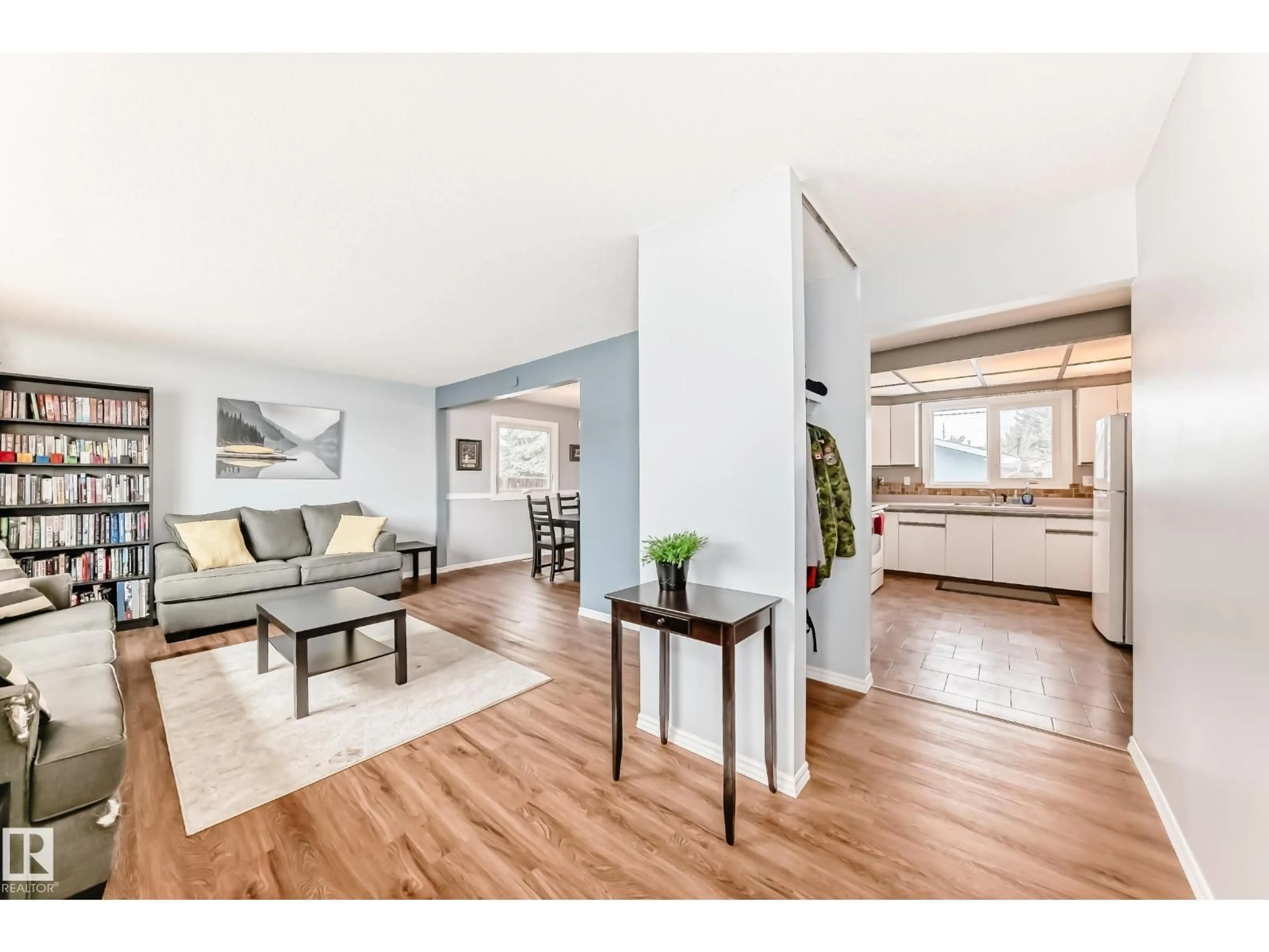 Living room with furniture, wood/laminate floor for 7512 136 AV, Edmonton Alberta T5C2K5