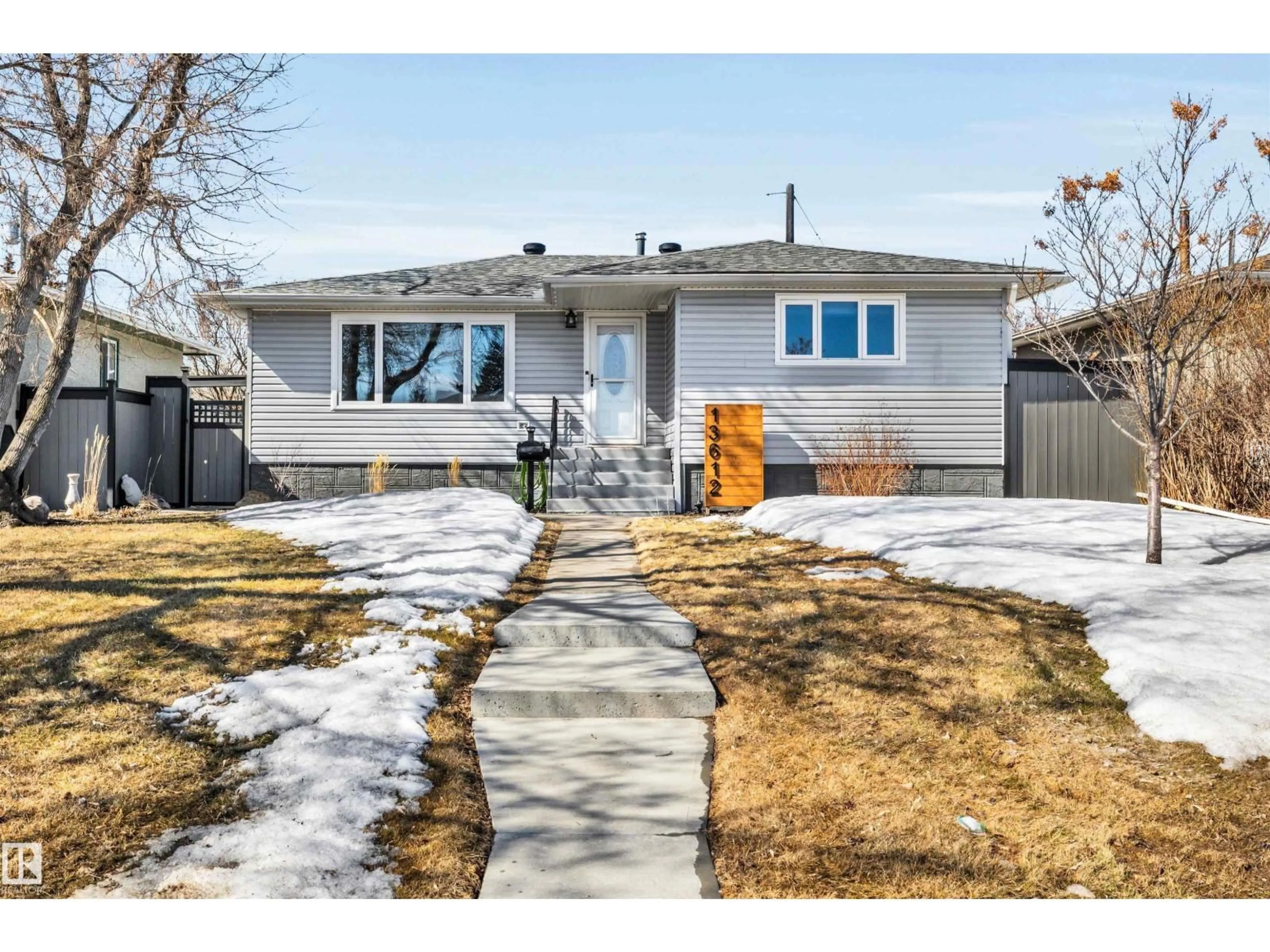 Home with vinyl exterior material, street for 13612 111 ST, Edmonton Alberta T5E4Z8