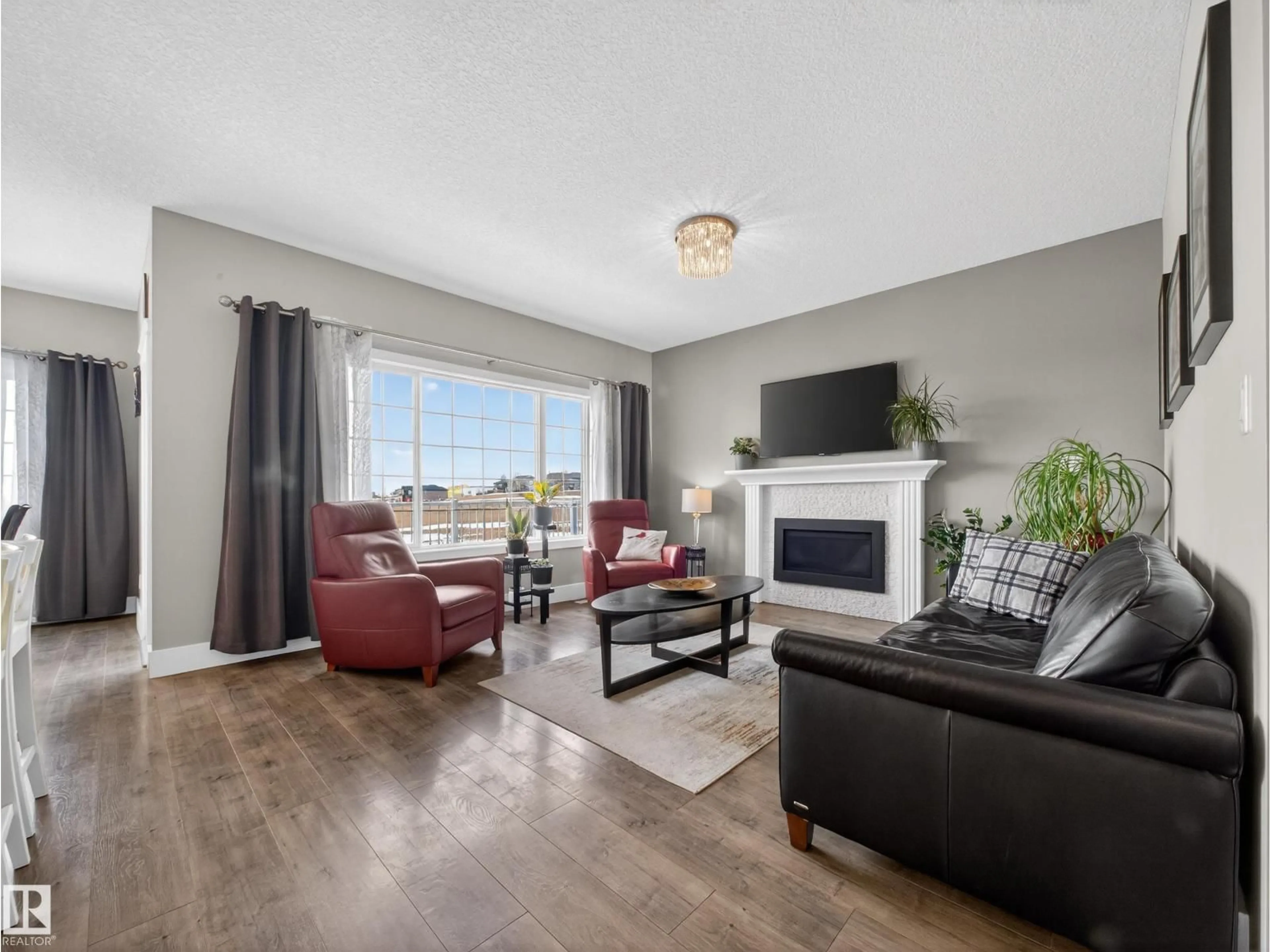 Living room with furniture, unknown for LI NW - 1047 COOPERS HAWK LINK, Edmonton Alberta T5S0M2