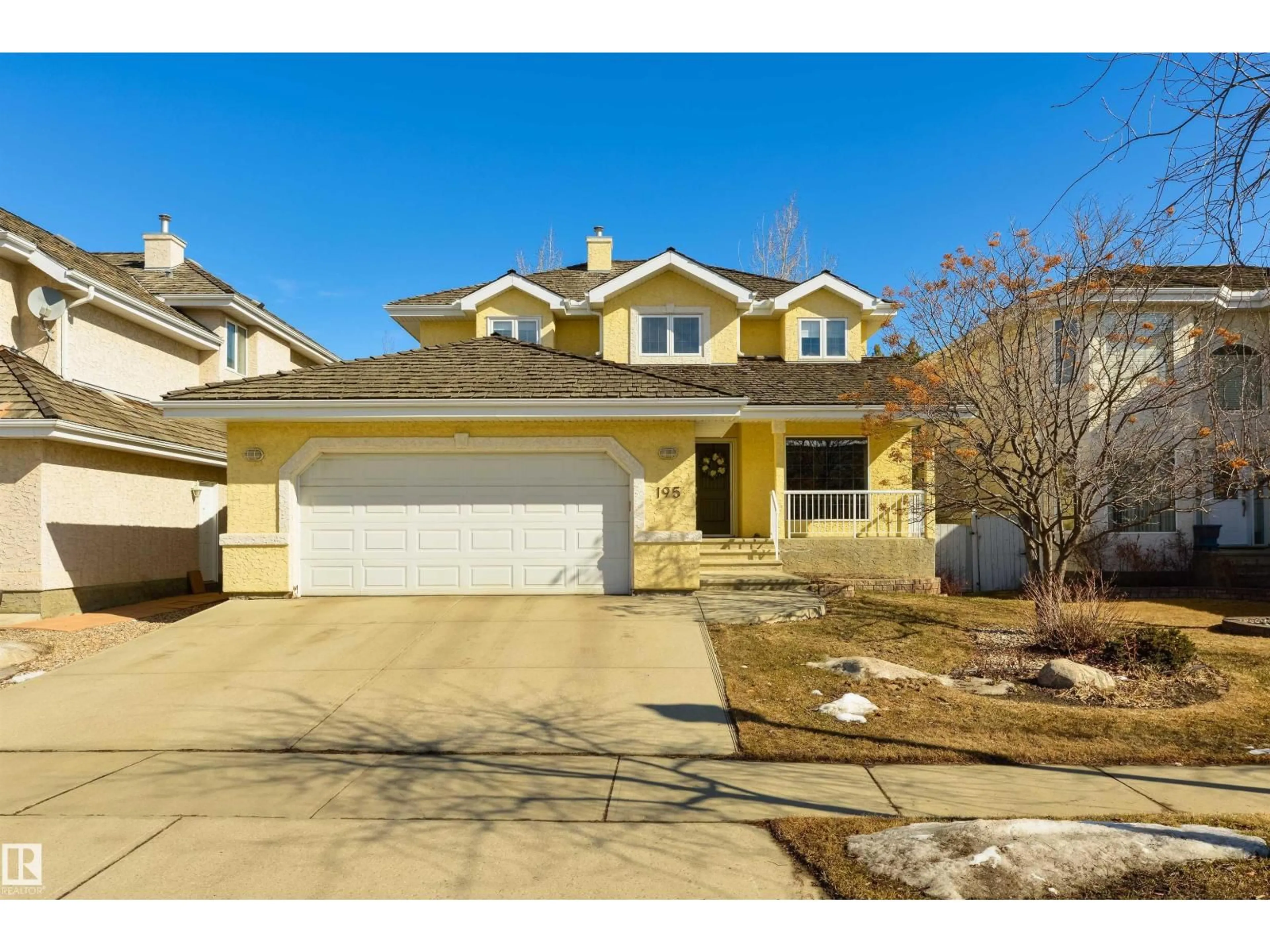 Home with vinyl exterior material, street for 195 DARLINGTON CR, Edmonton Alberta T5M2T2