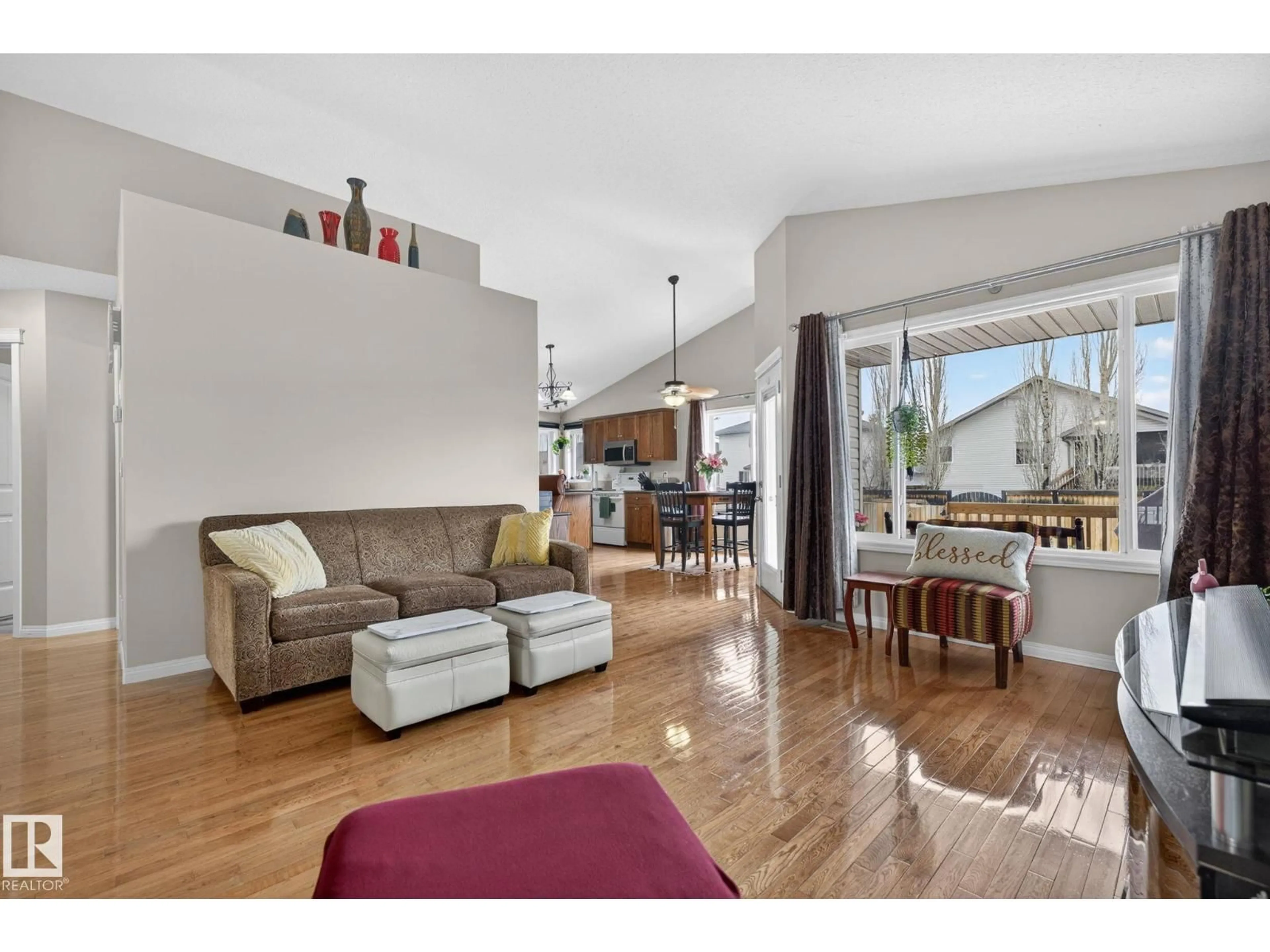 Living room with furniture, wood/laminate floor for 5414 59 ST, Camrose Alberta T4V5B9