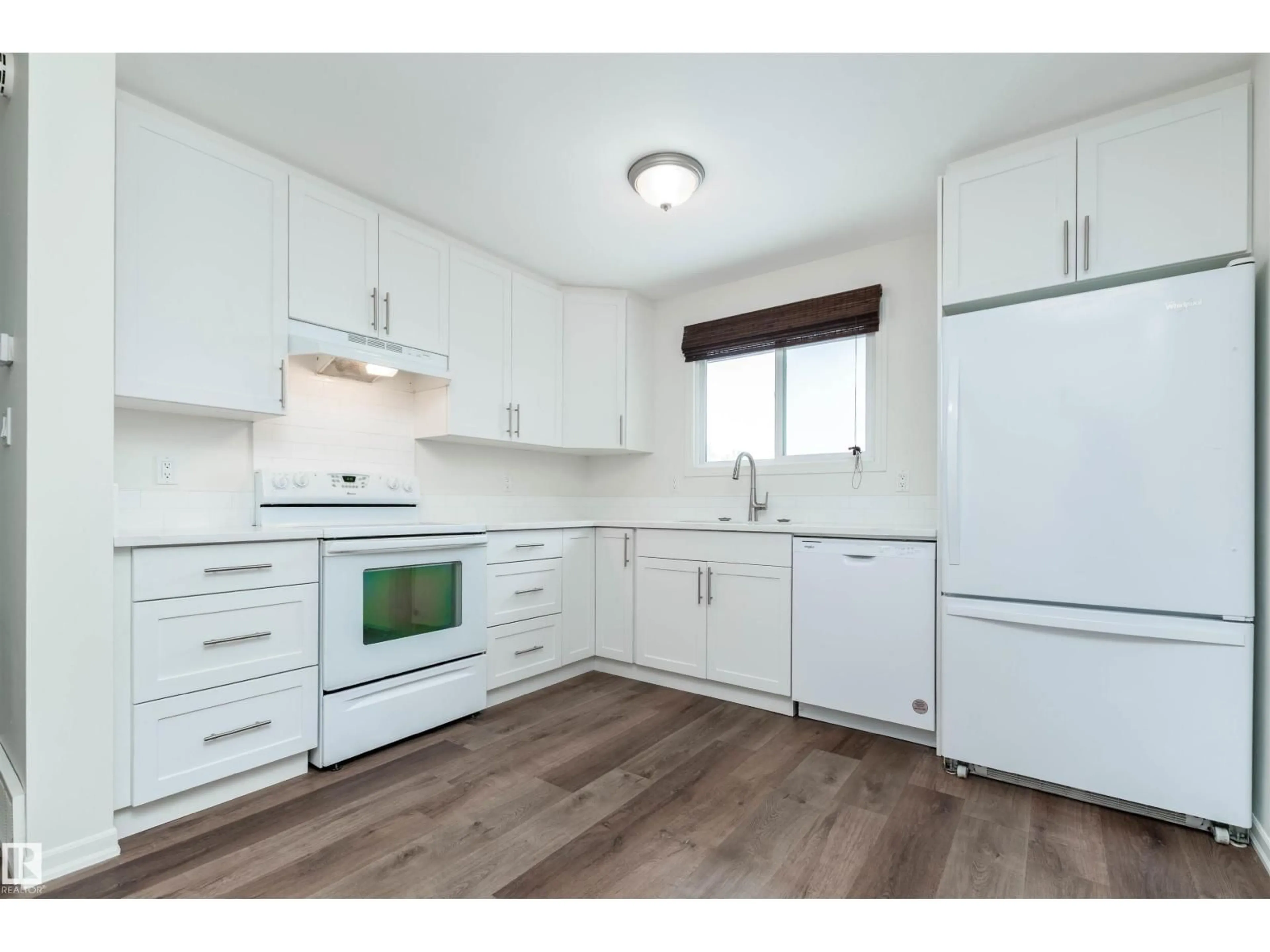 Standard kitchen, wood/laminate floor for NW - 14636 25 ST, Edmonton Alberta T5Y1X4