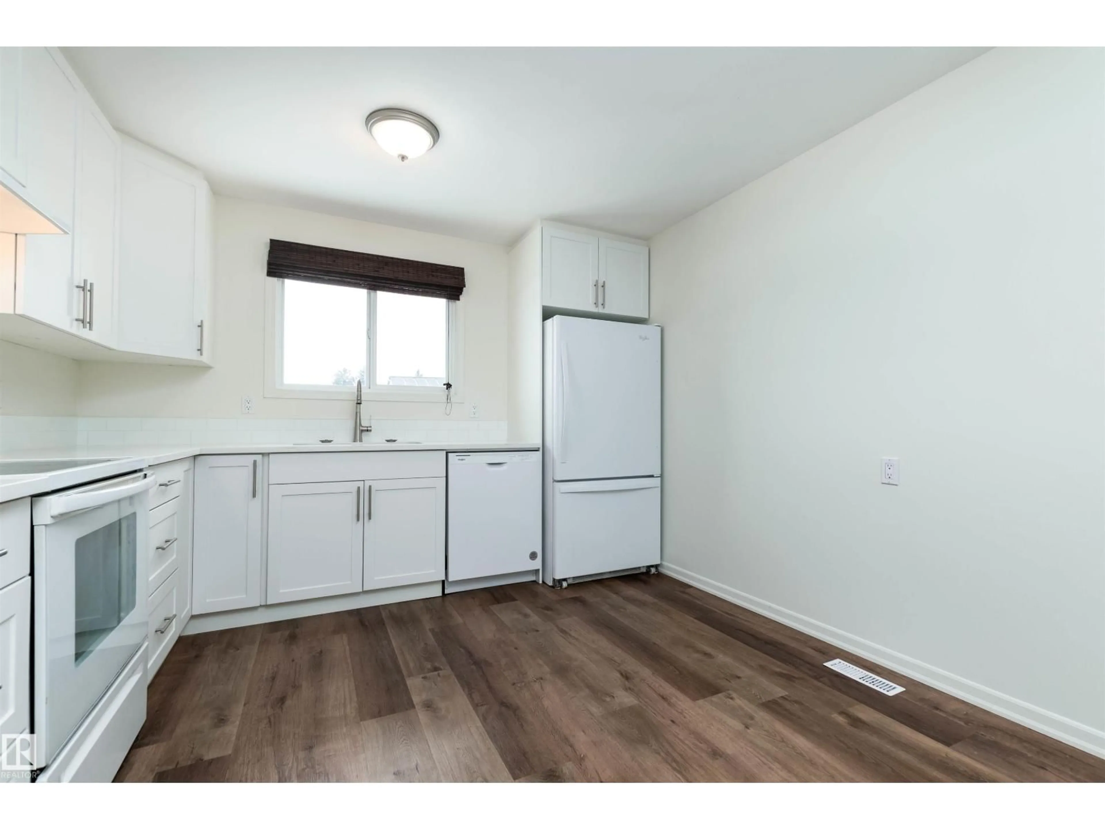 Standard kitchen, wood/laminate floor for NW - 14636 25 ST, Edmonton Alberta T5Y1X4