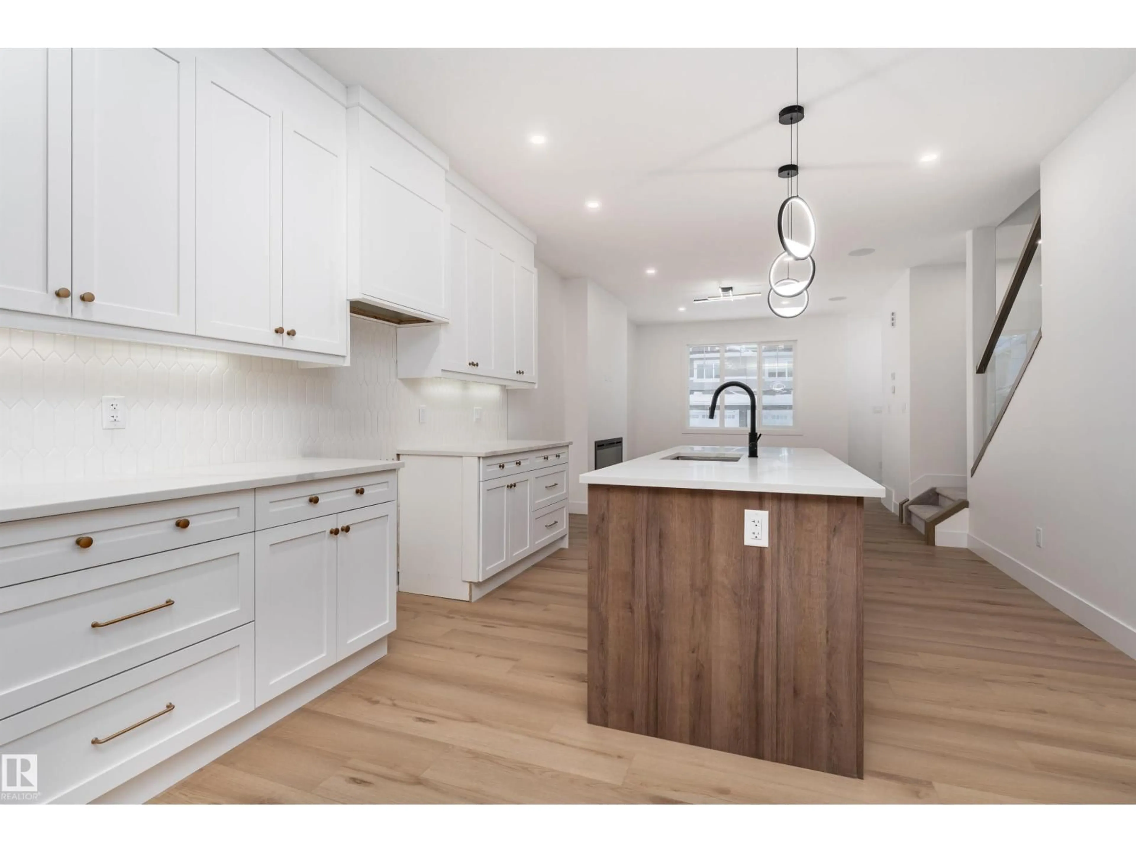 Open concept kitchen, wood/laminate floor for 3109 MAGPIE WY, Edmonton Alberta T5S0V3