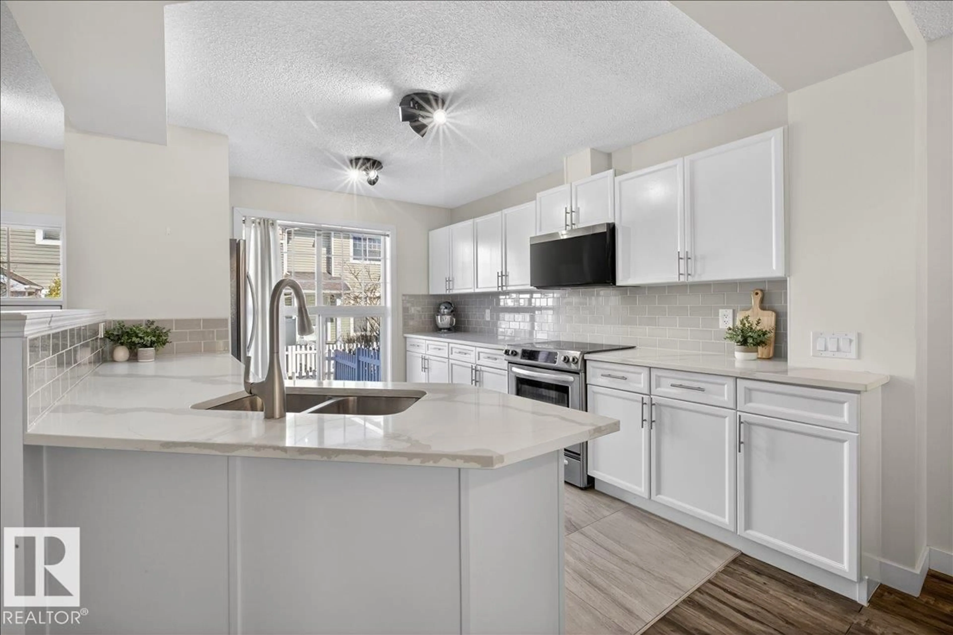 Open concept kitchen, ceramic/tile floor for #174 - 5604 199 ST, Edmonton Alberta T6M2Z9