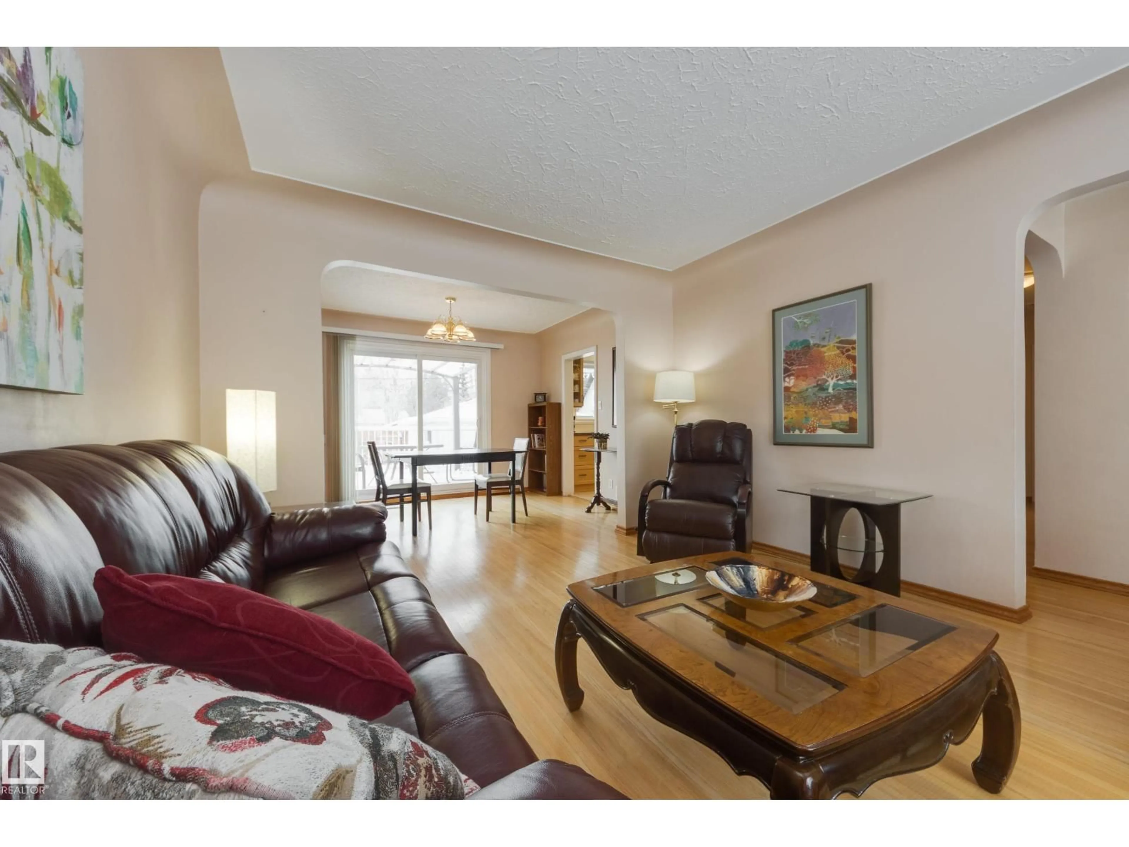 Living room with furniture, wood/laminate floor for NW - 10626 130 ST, Edmonton Alberta T5N1Y2