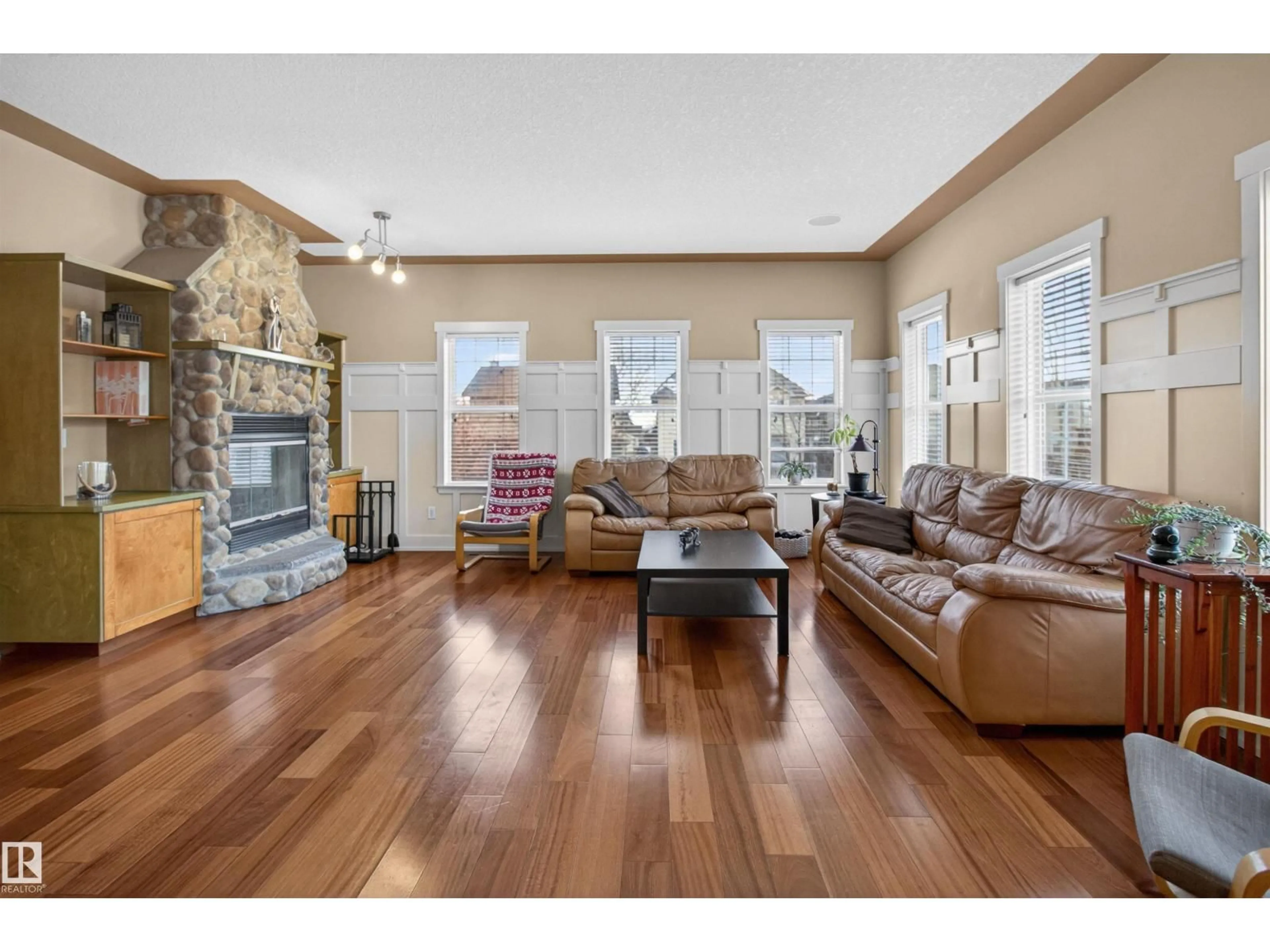 Living room with furniture, wood/laminate floor for 1 CHATWIN RD, Sherwood Park Alberta T8H2S7