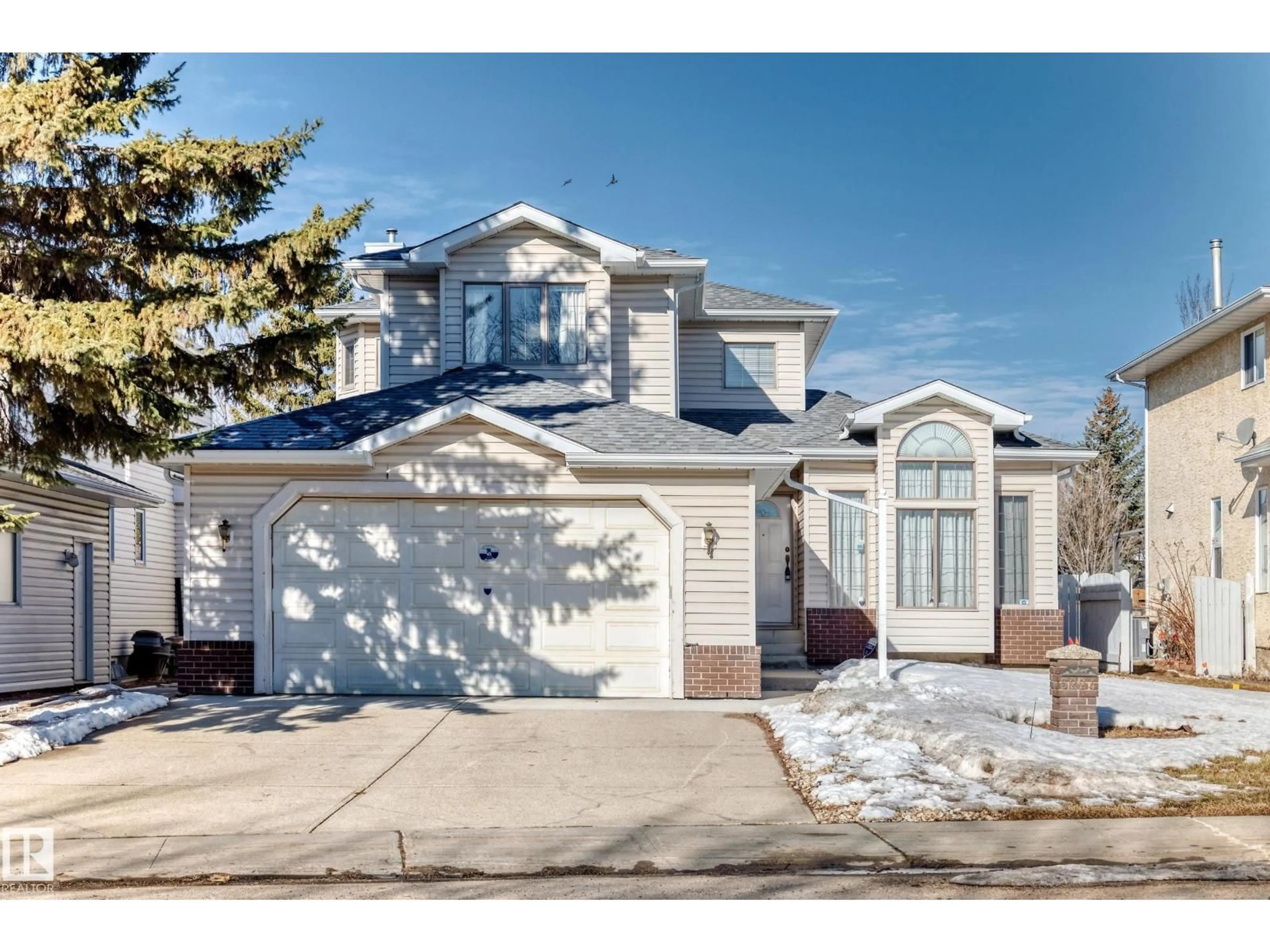 Home with vinyl exterior material, street for 5224 190 ST, Edmonton Alberta T6M2L2