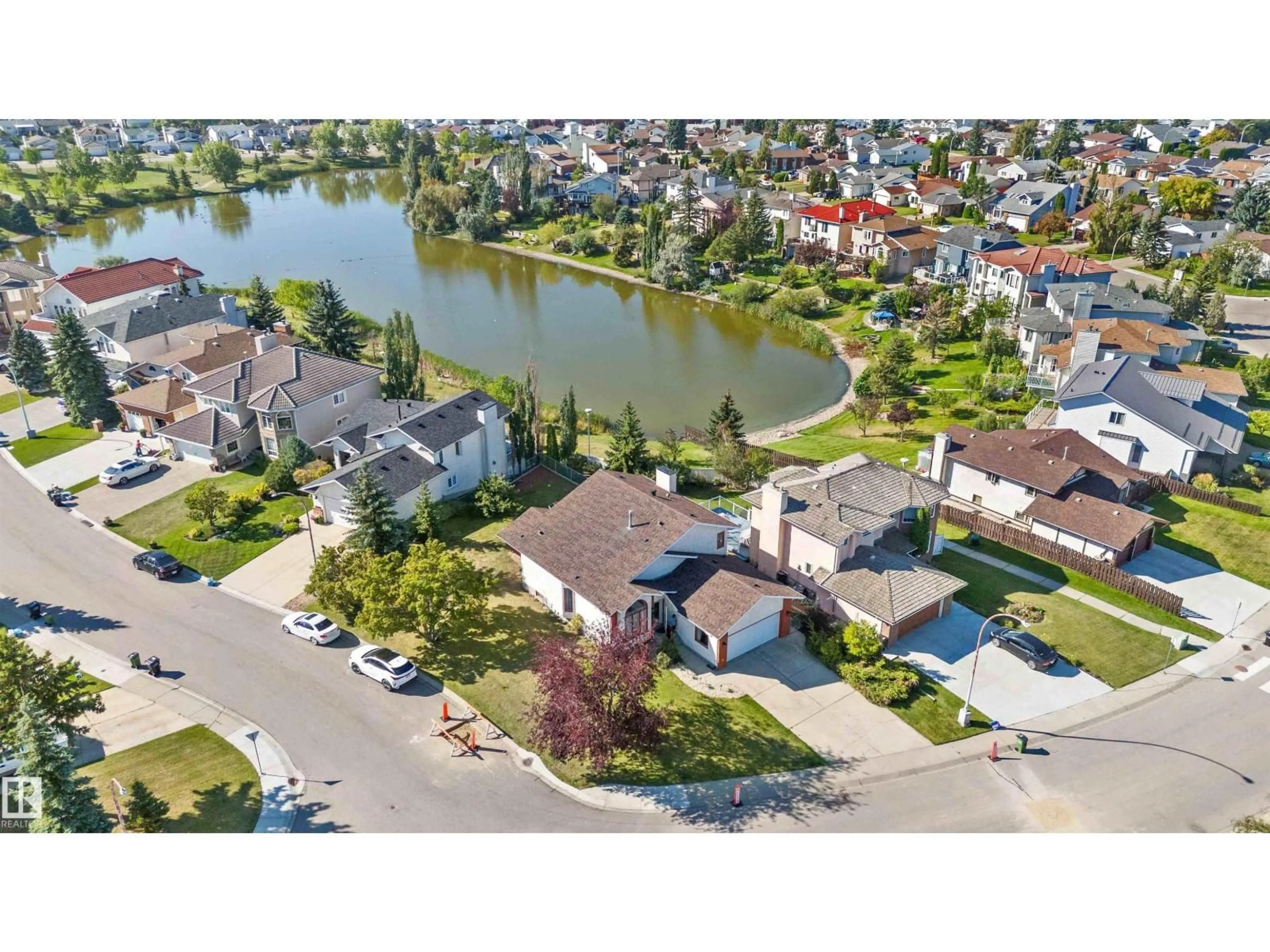 A pic from outside/outdoor area/front of a property/back of a property/a pic from drone, water/lake/river/ocean view for 7607 158 AV, Edmonton Alberta T5Z2R9