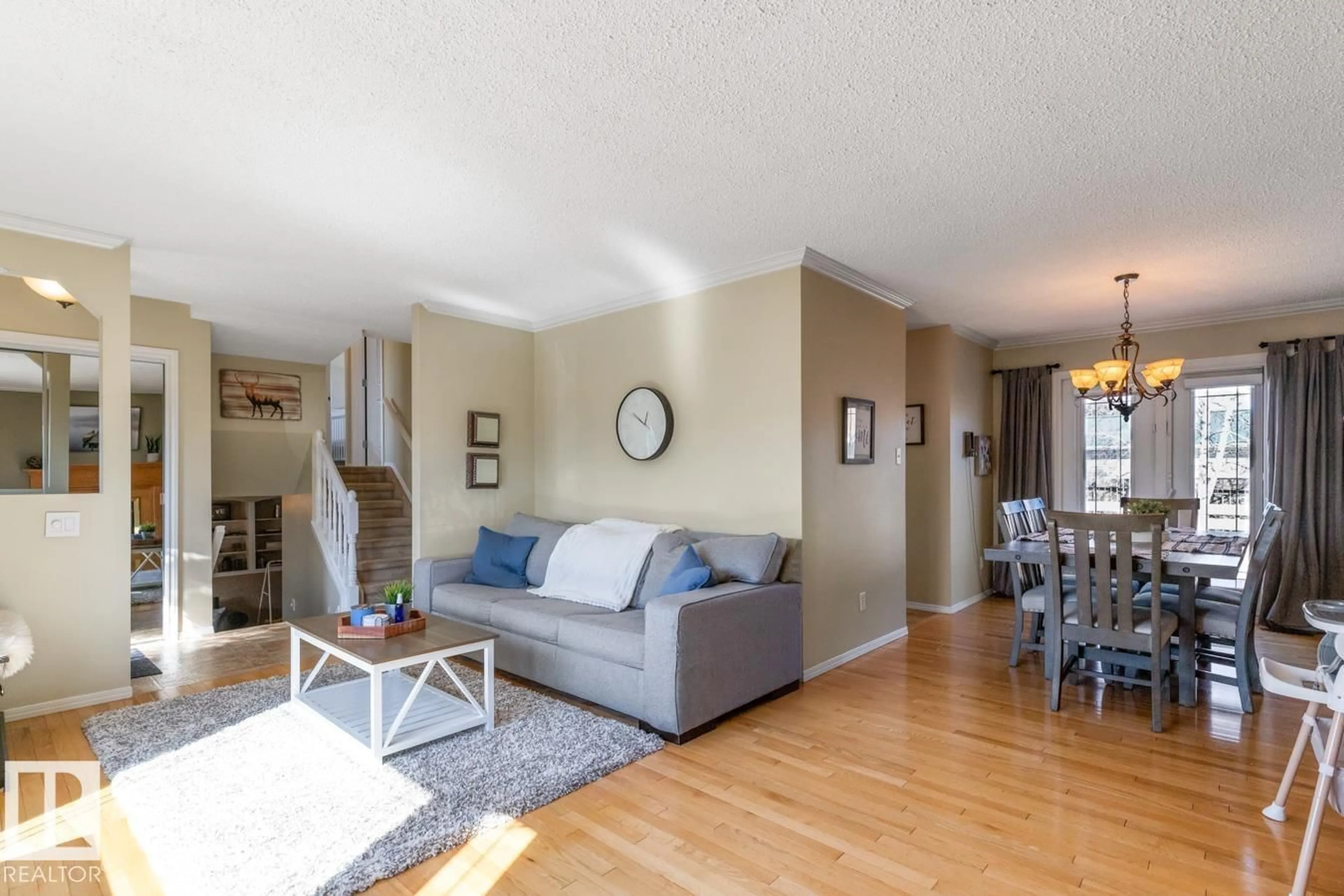 Living room with furniture, wood/laminate floor for NW - 13420 25 ST, Edmonton Alberta T5A3T2