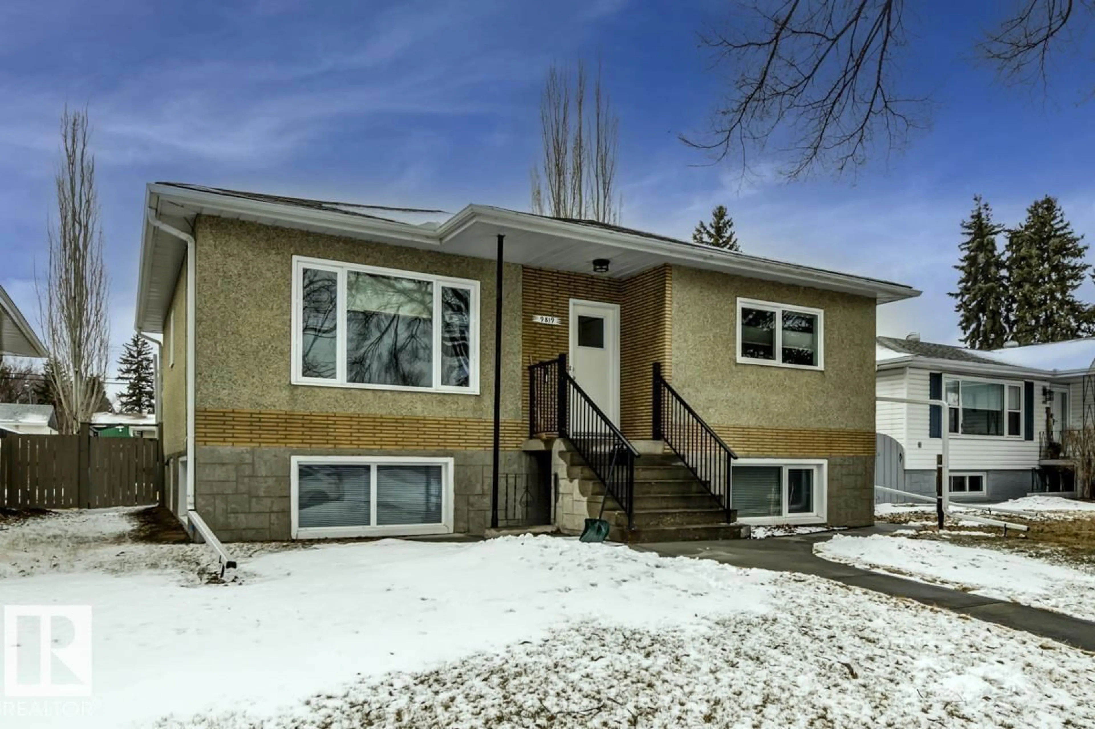 Home with vinyl exterior material, street for 9819 67 AV, Edmonton Alberta T6E0P3