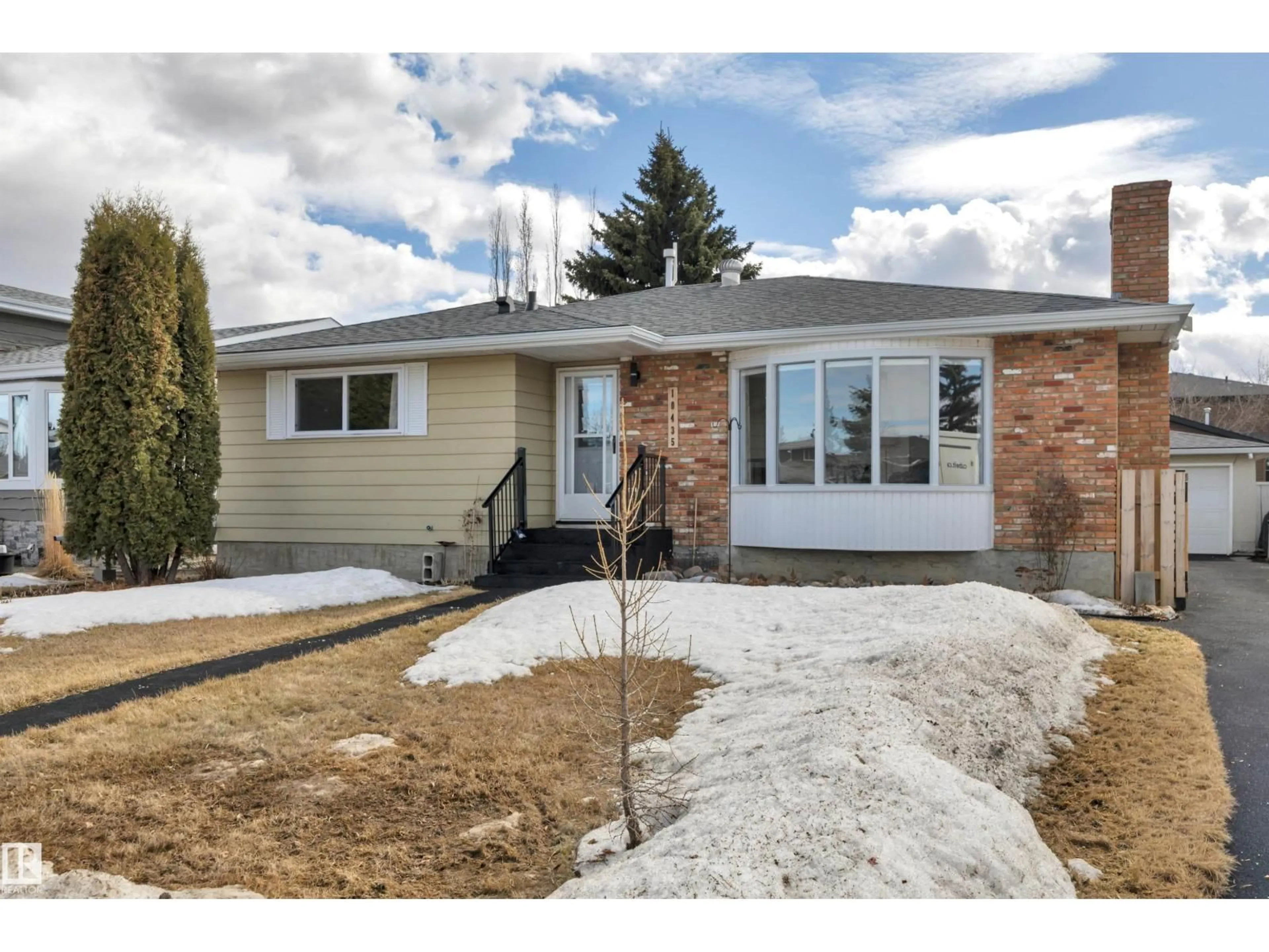 Home with brick exterior material, street for 10435 39A AV, Edmonton Alberta T6J2J5