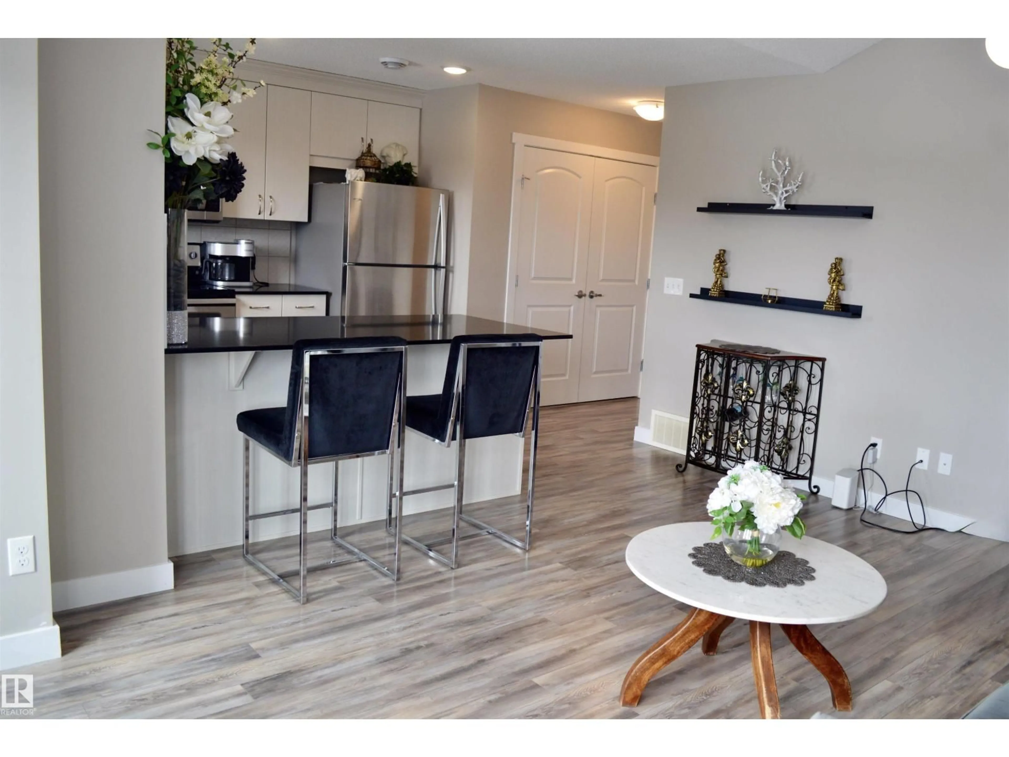 Open concept kitchen, wood/laminate floor for #11 - 1203 163 ST, Edmonton Alberta T6W3X1