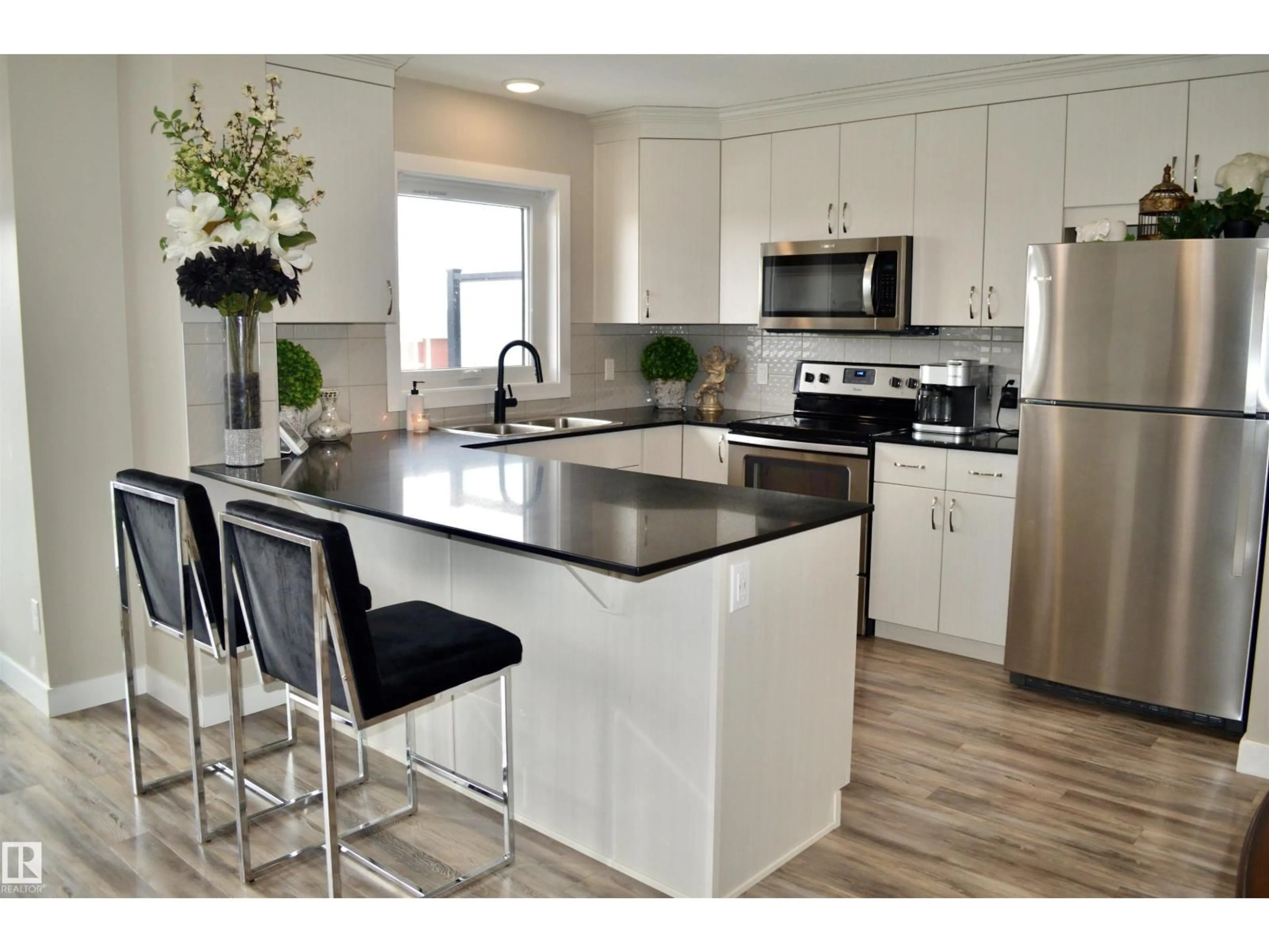 Open concept kitchen, unknown for #11 - 1203 163 ST, Edmonton Alberta T6W3X1