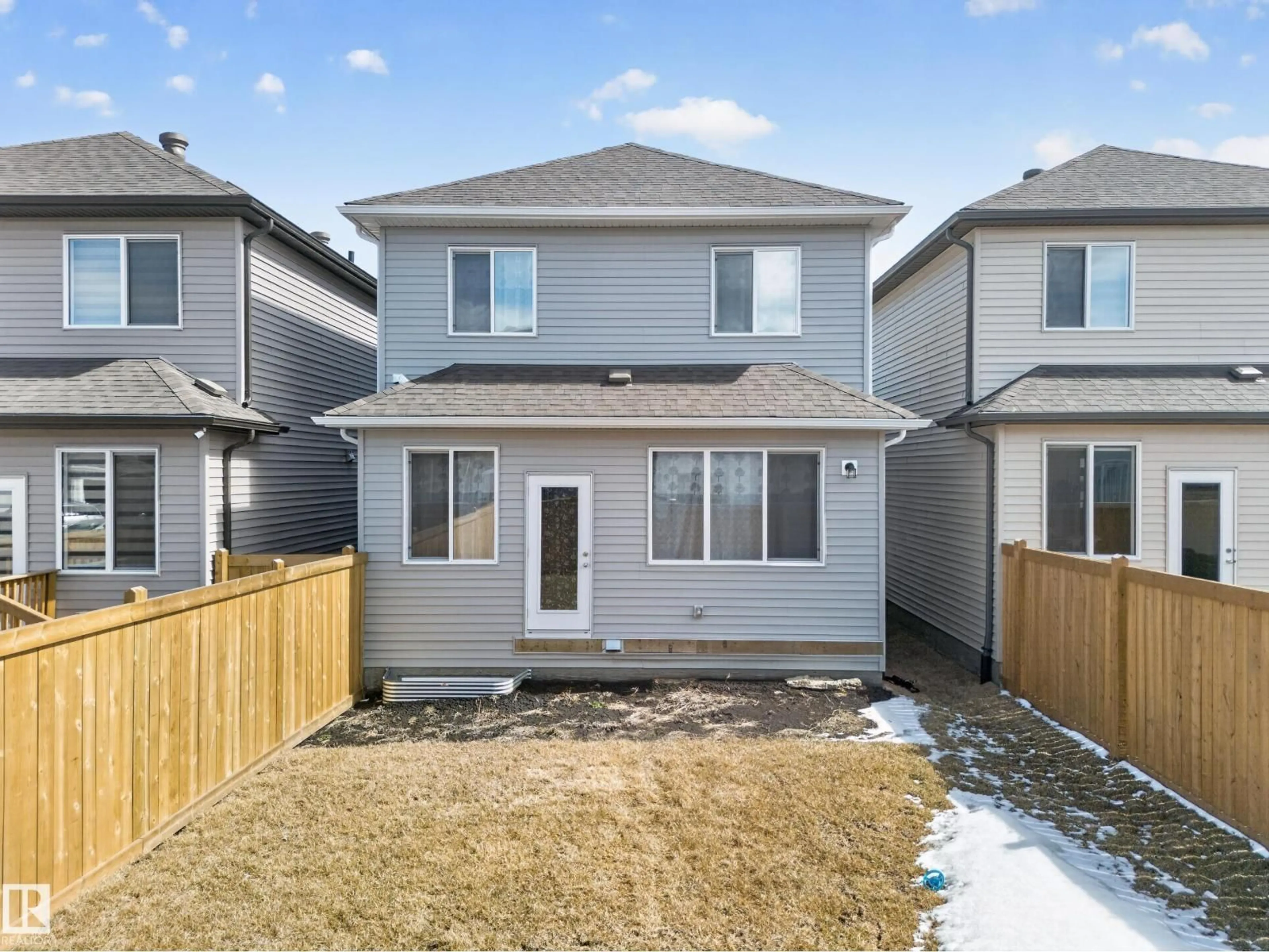 Home with vinyl exterior material, street for NW - 1684 12 ST, Edmonton Alberta T6T2N4