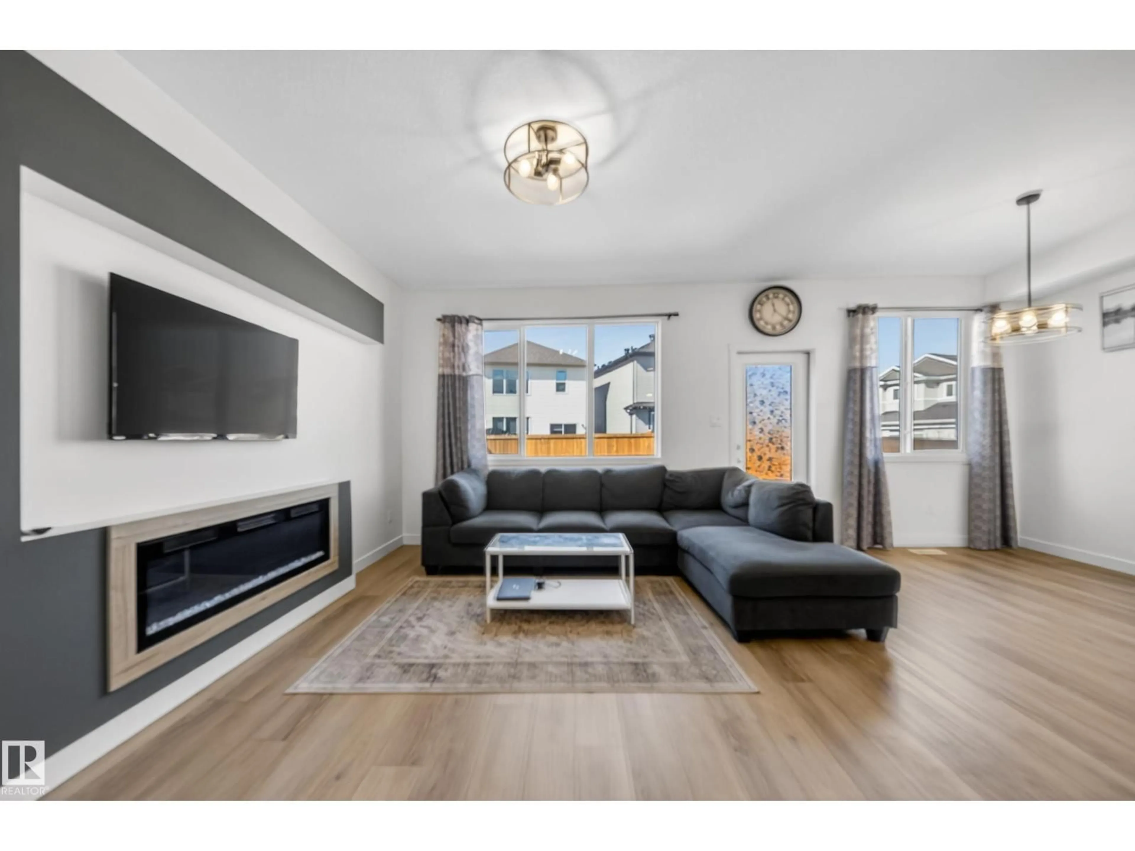 Living room with furniture, wood/laminate floor for NW - 1684 12 ST, Edmonton Alberta T6T2N4