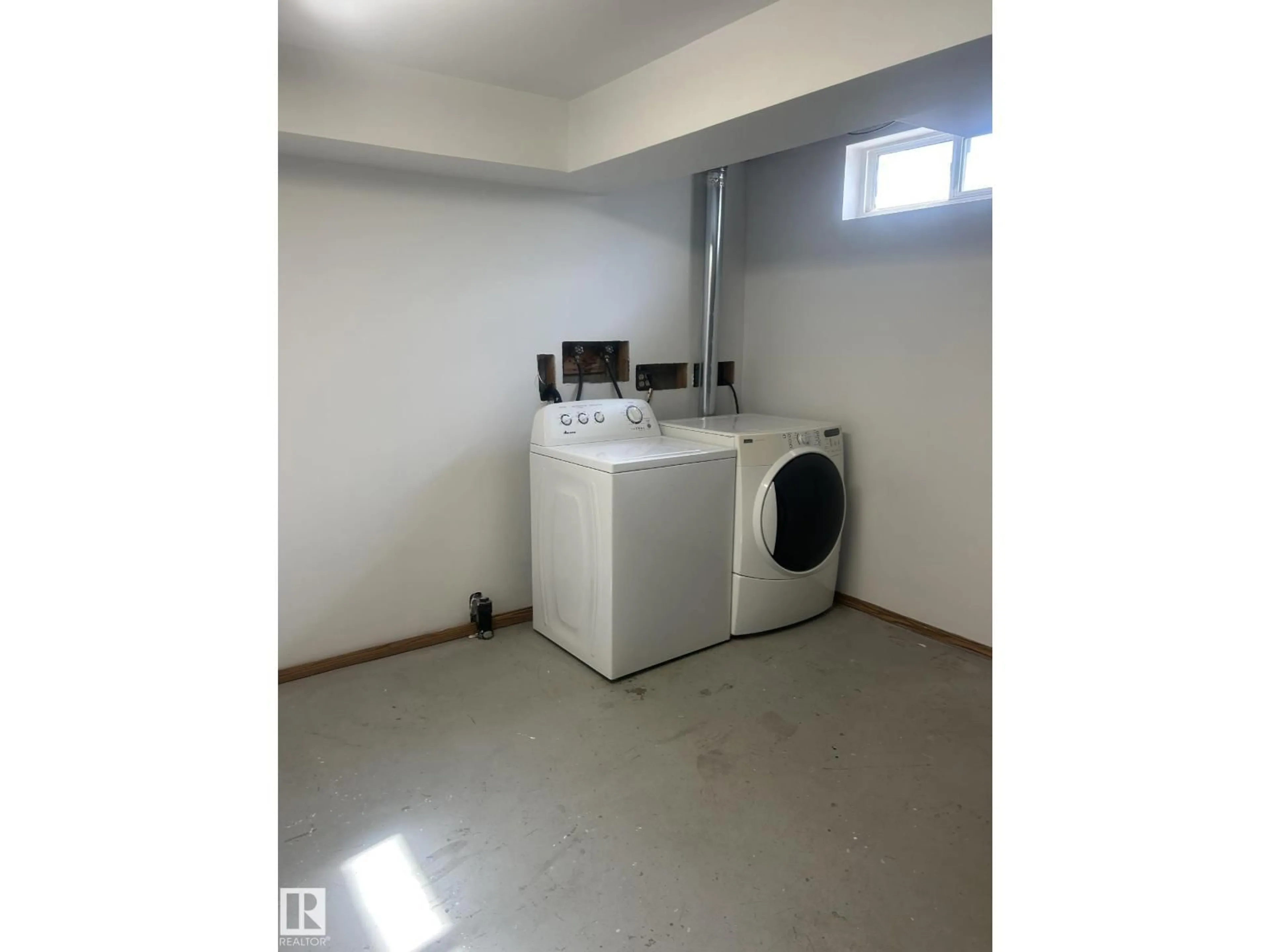 Laundry room for 11504 139 AV, Edmonton Alberta T5X3L4