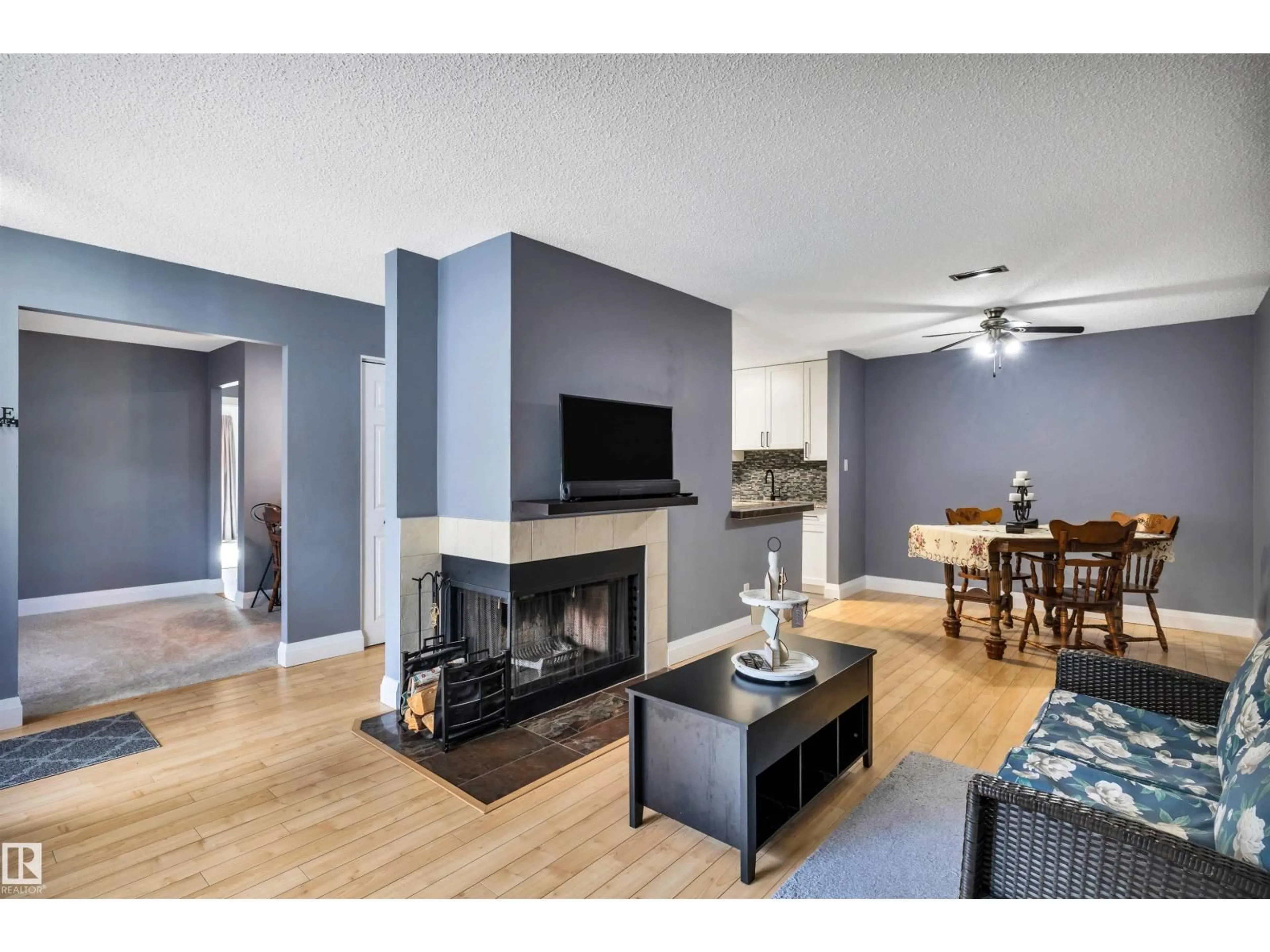 Living room with furniture, wood/laminate floor for 70 - 148 WOODLANDS RD, St. Albert Alberta T8N5H2