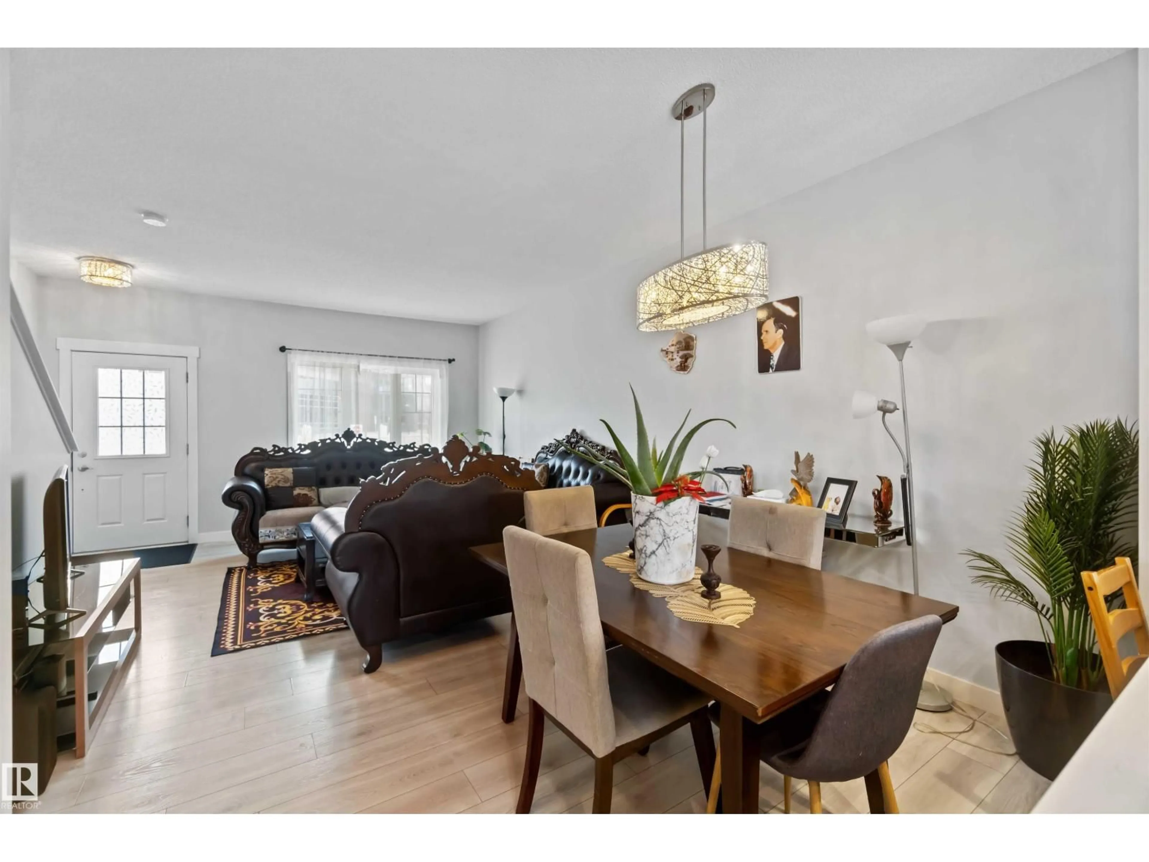 Dining room, wood/laminate floor for 2725 ORCHARDS RD, Edmonton Alberta T6X2M9