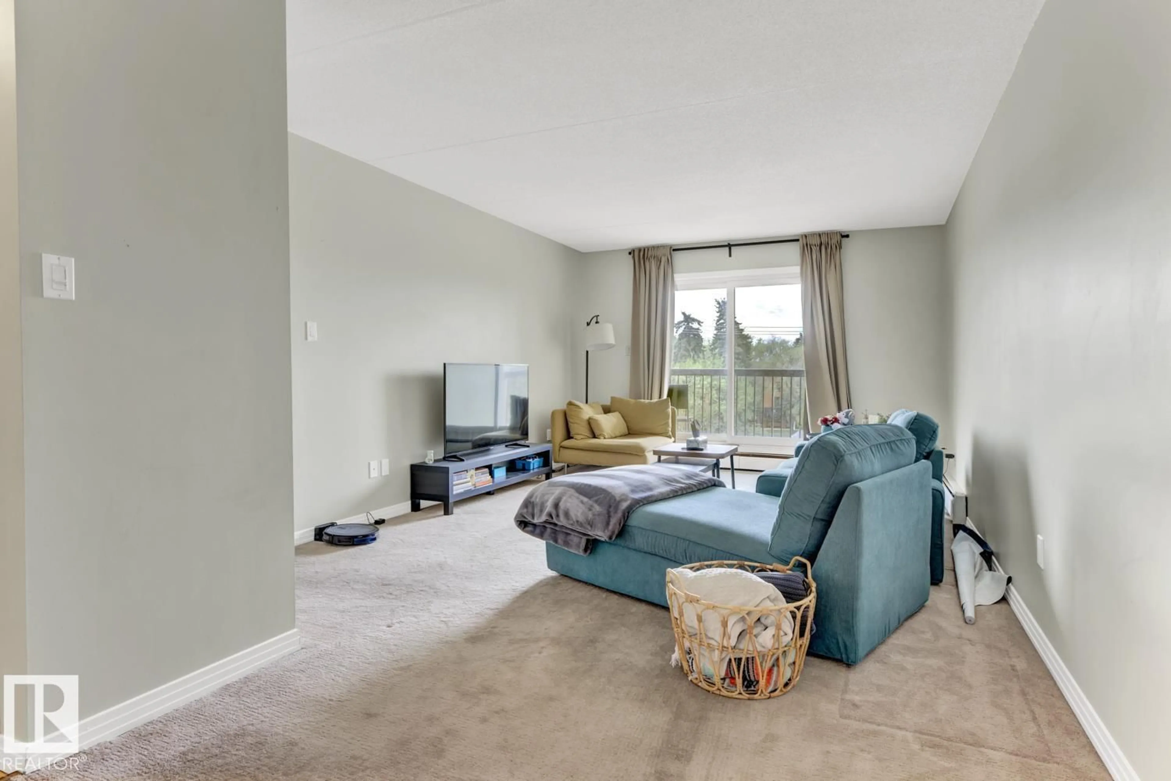 Living room with furniture, carpet floor for 400 - 11026 106 ST NW, Edmonton Alberta T5H2Y4