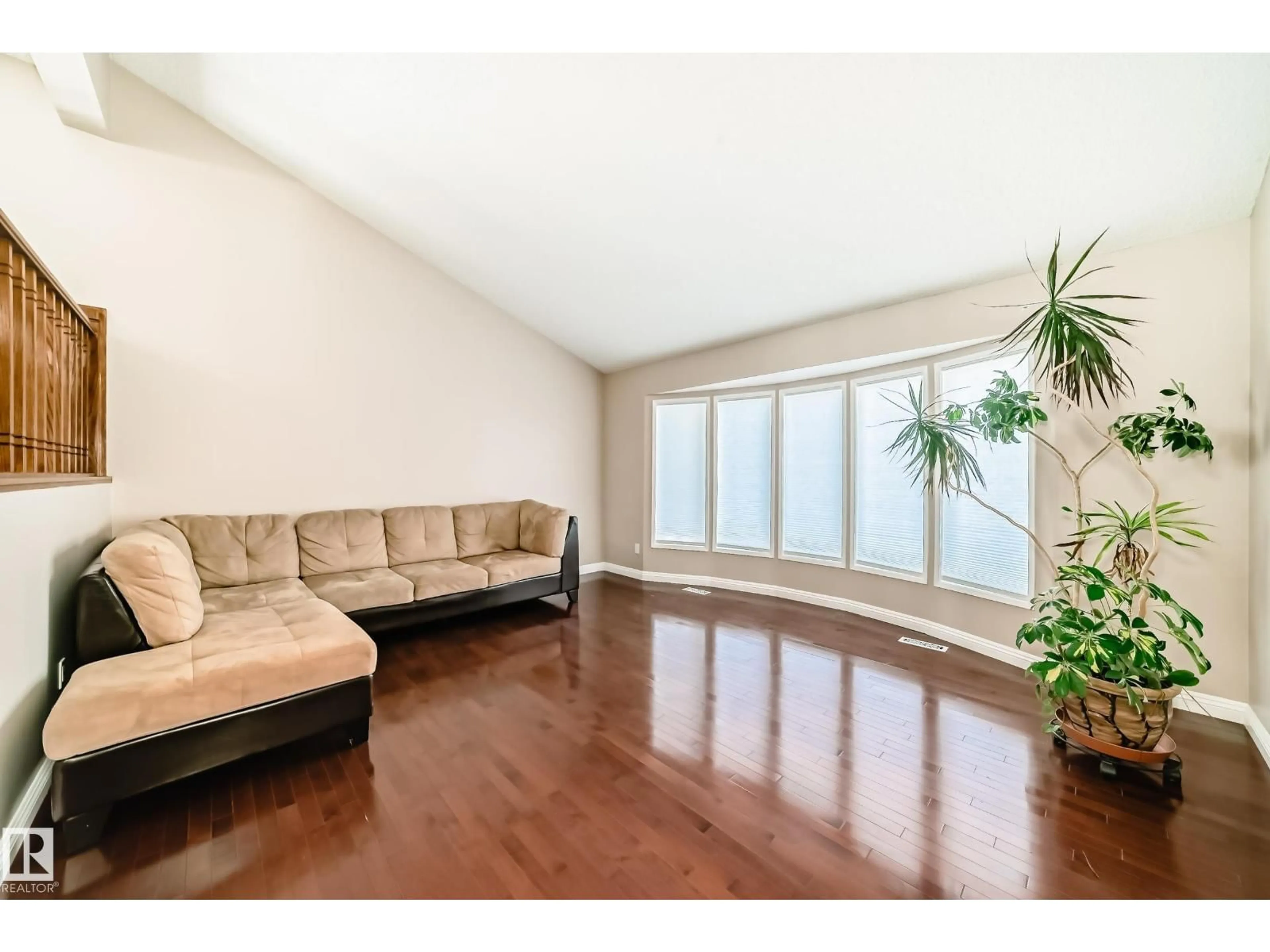 Living room with furniture, wood/laminate floor for 287 LAGO LINDO CR, Edmonton Alberta T5Z1Y5